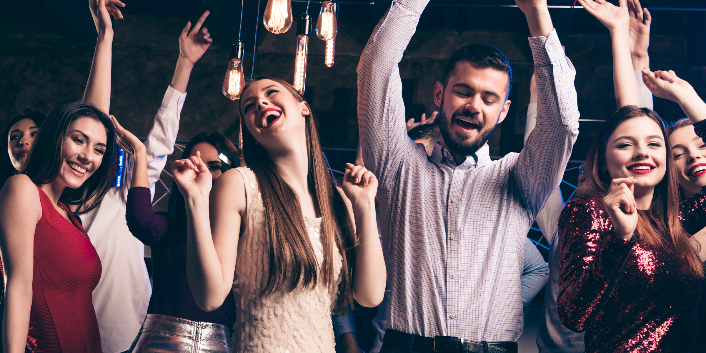 Friends dancing at a party | Source: Shutterstock