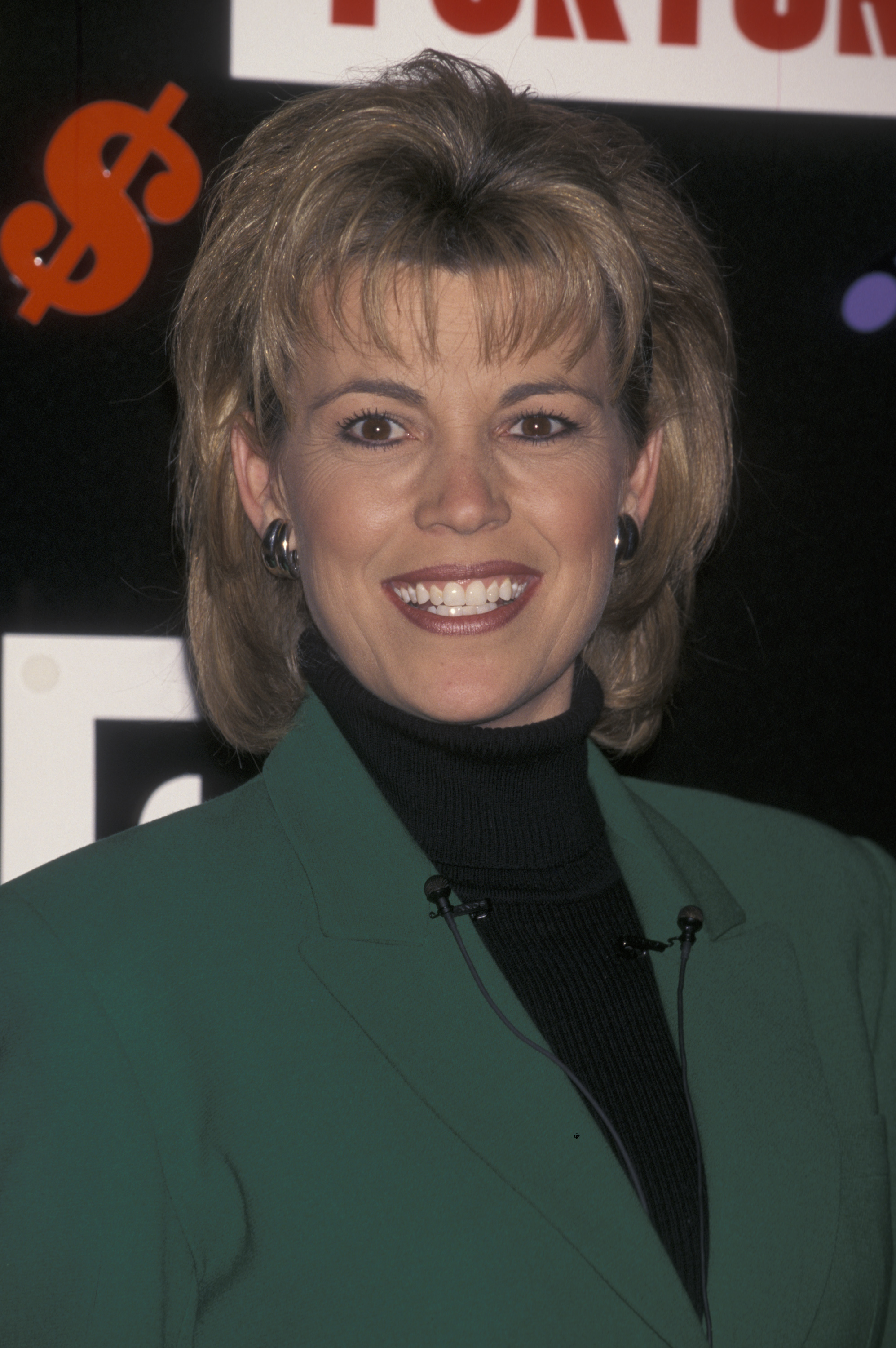 Vanna White smiles in a green blazer over a black turtleneck while attending Gilda's Club Play To Win Event at Sony Plaza Atrium in New York City.