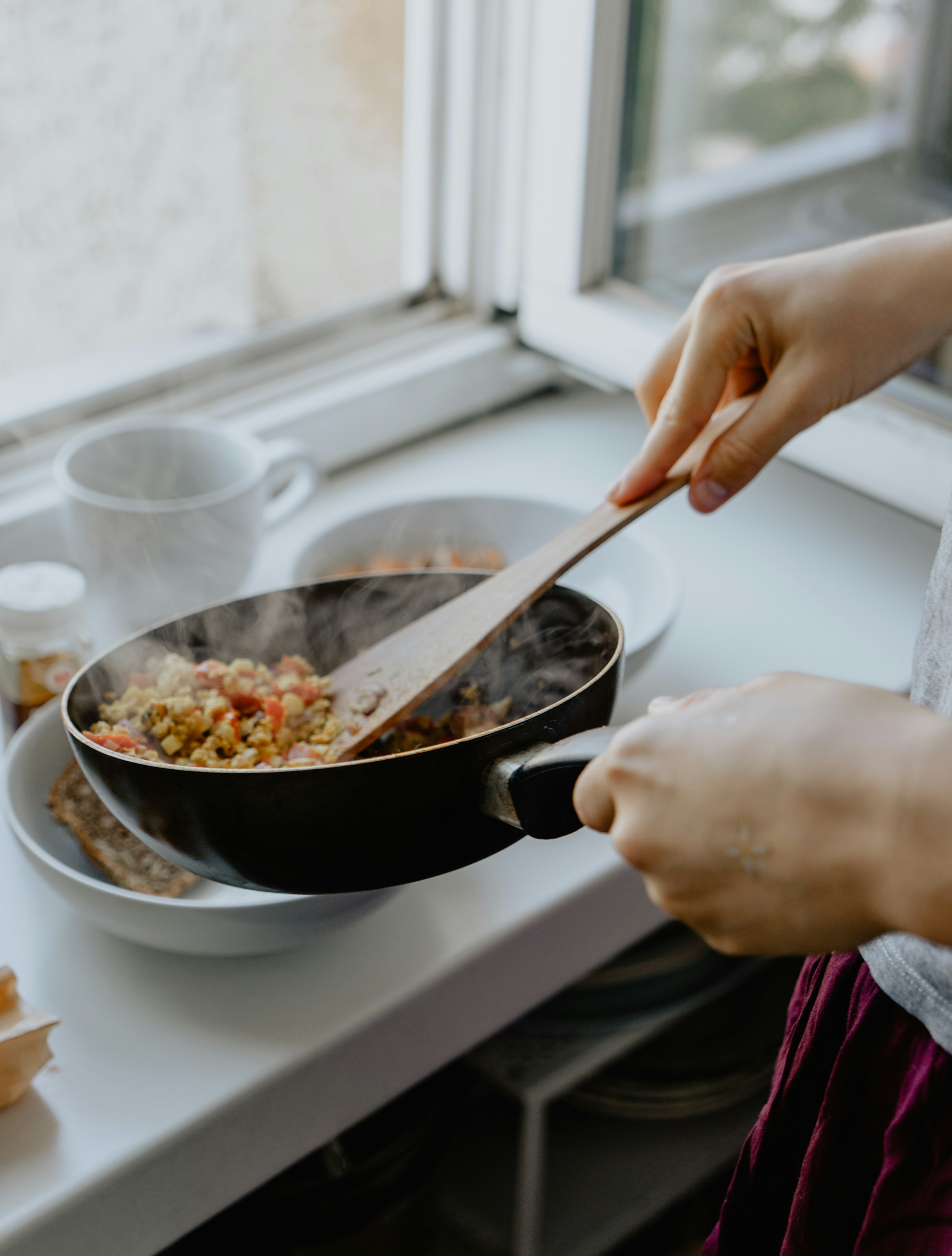 A person busy in the kitchen | Source: Unsplash