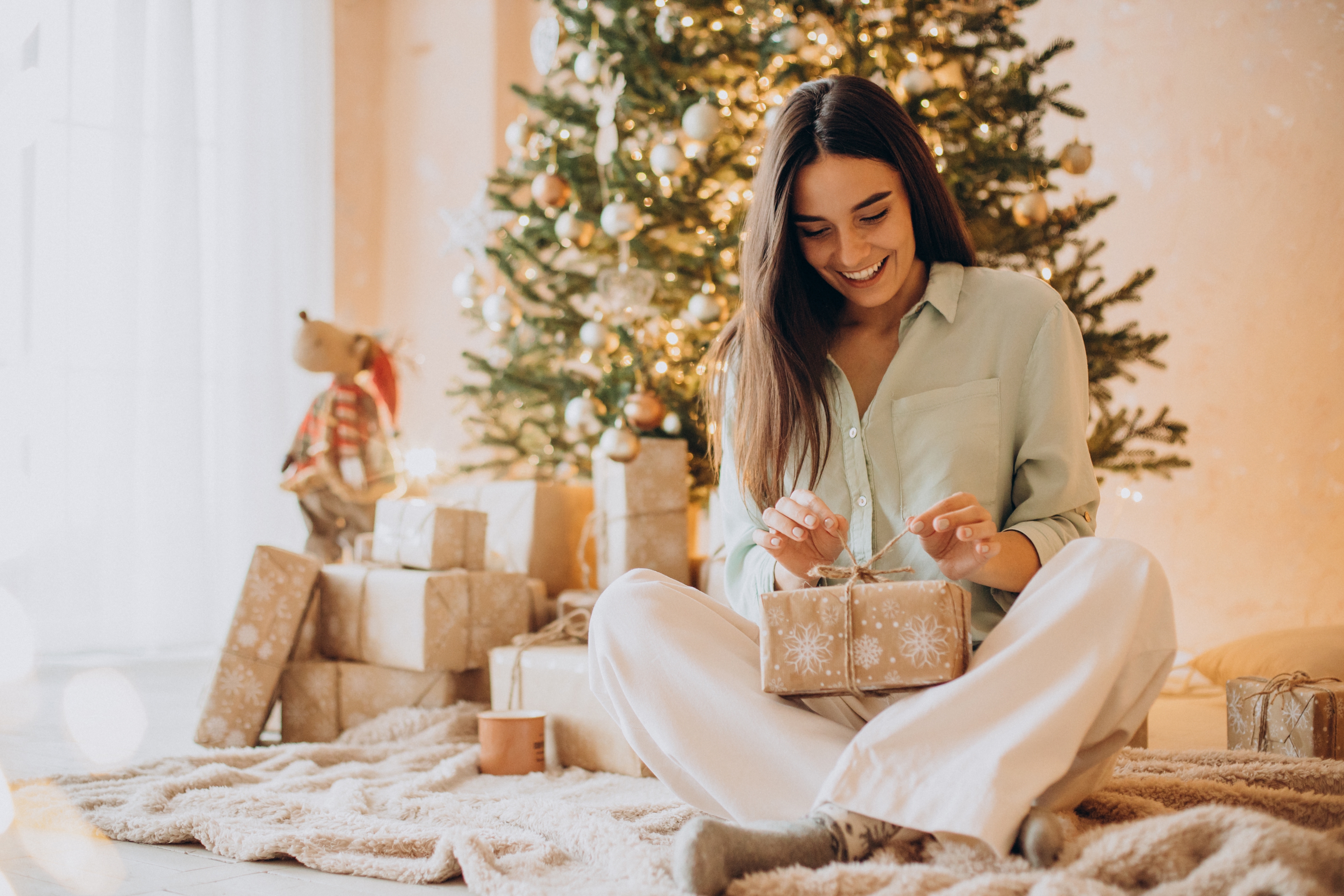 A woman opening a gift | Source: Shutterstock