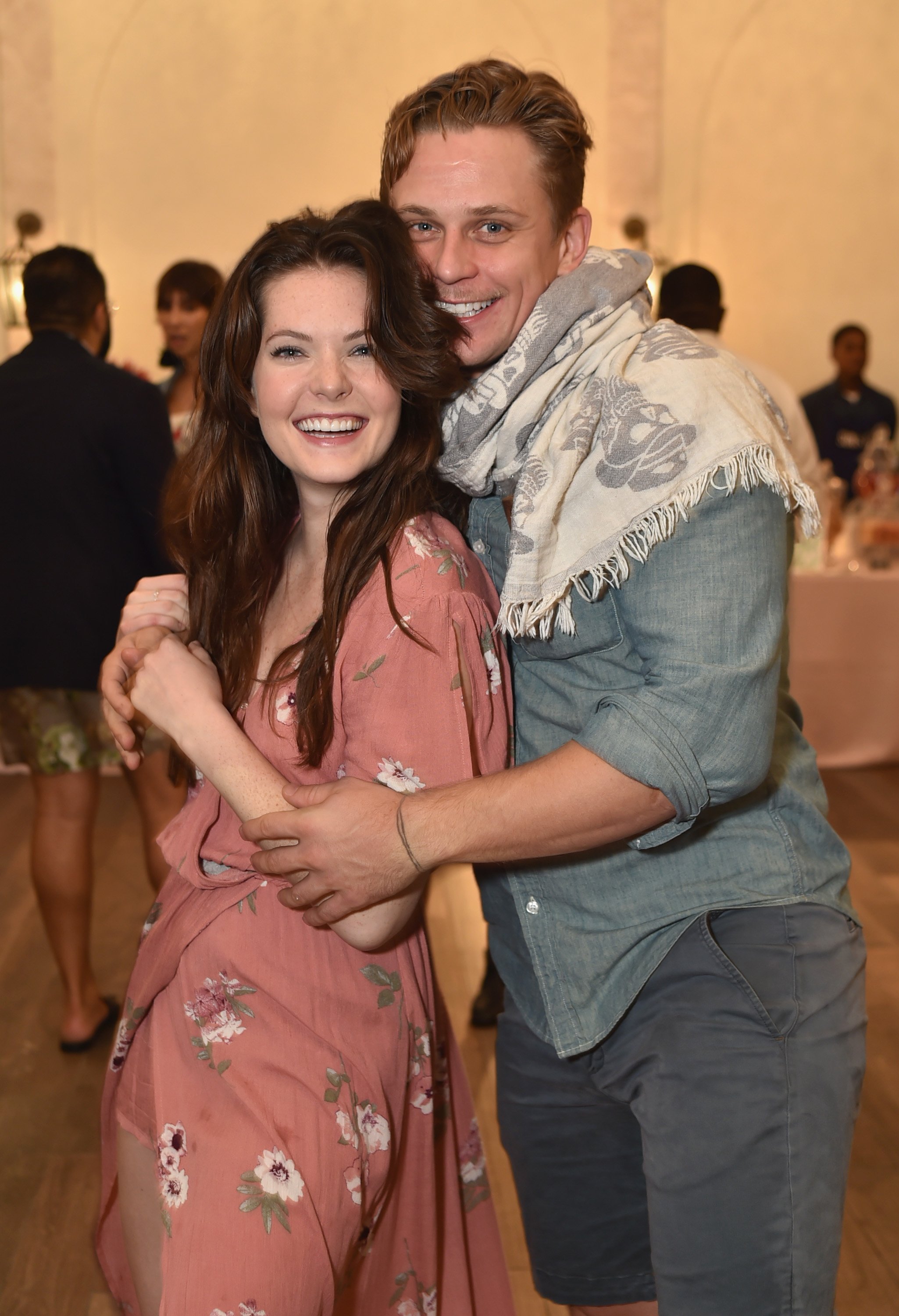 Meghann Fahy and Billy Magnussen smile for a photo at the weekend opening of The NEW ultra-luxury Cove Resort at Atlantis Paradise Island on November 3, 2017, in The Bahamas | Source: Getty Images