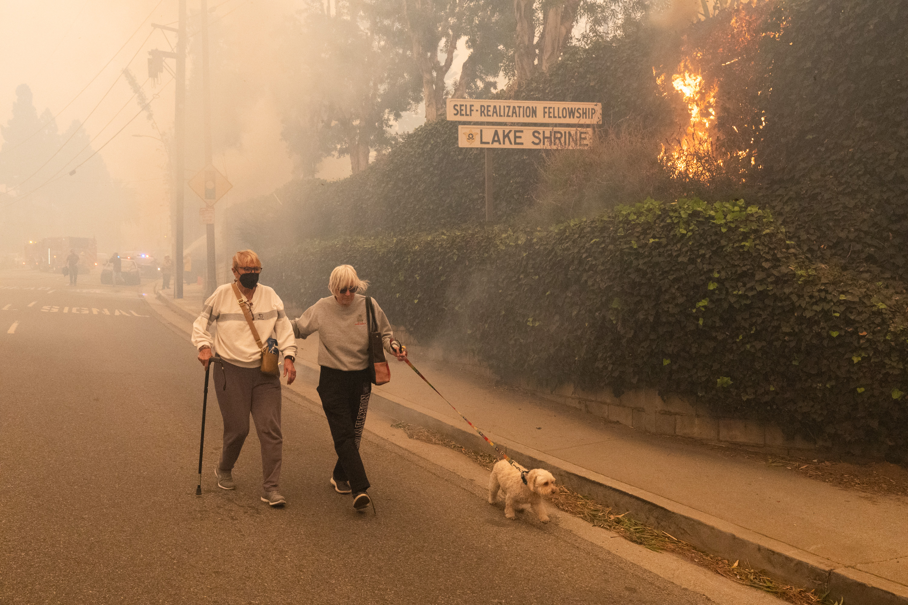 Residents evacuate as the brush fire, fueled by strong Santa Ana winds, burns in Pacific Palisades, Los Angeles on January 7, 2025 | Source: Getty Images