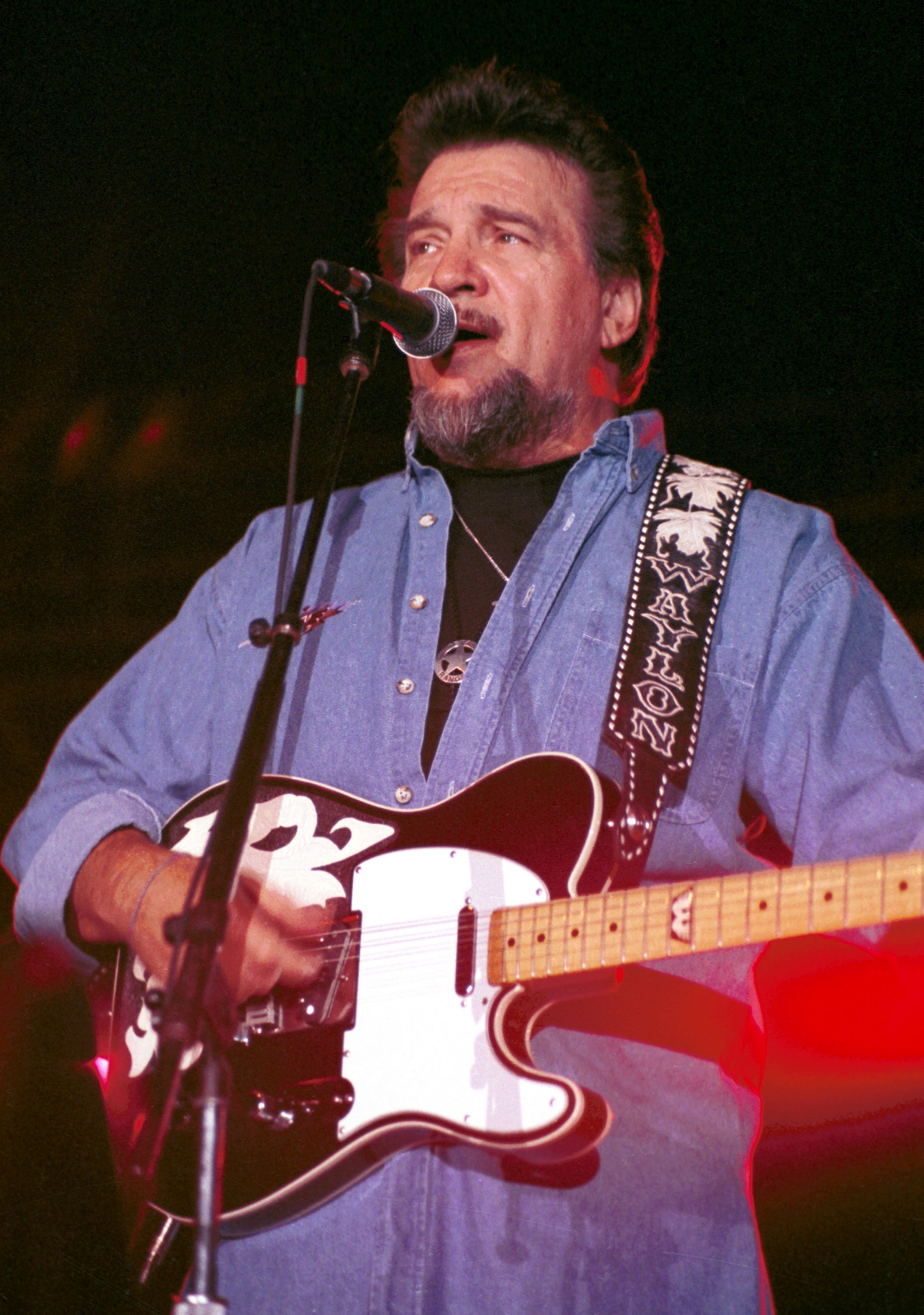 Waylon Jennings on stage - Getty Images