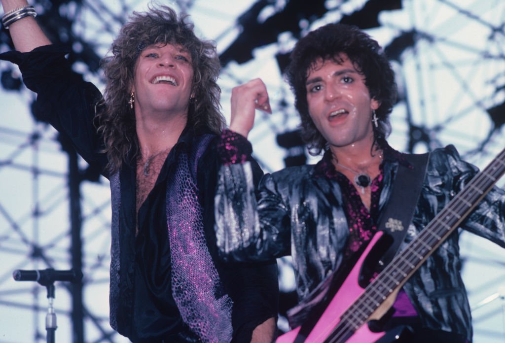 Jon Bon Jovi and bassist Alec John Such of Bon Jovi perform on stage in 1987. | Source: Getty Images