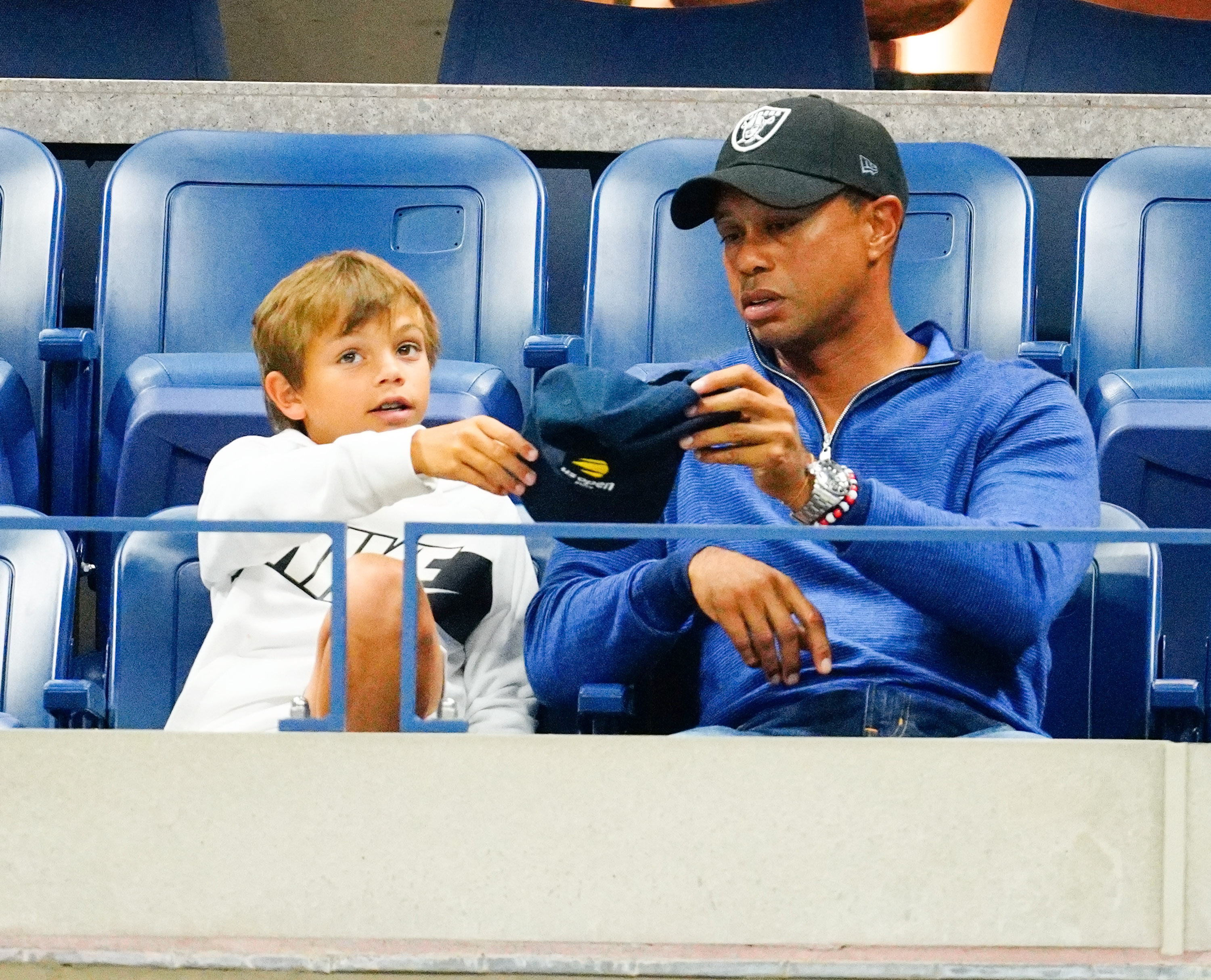 Tiger Woods and his son Charlie Woods cheer for Rafael Nadal at the 2019 US Open in New York City. The duo shared a courtside moment during the thrilling Grand Slam match.