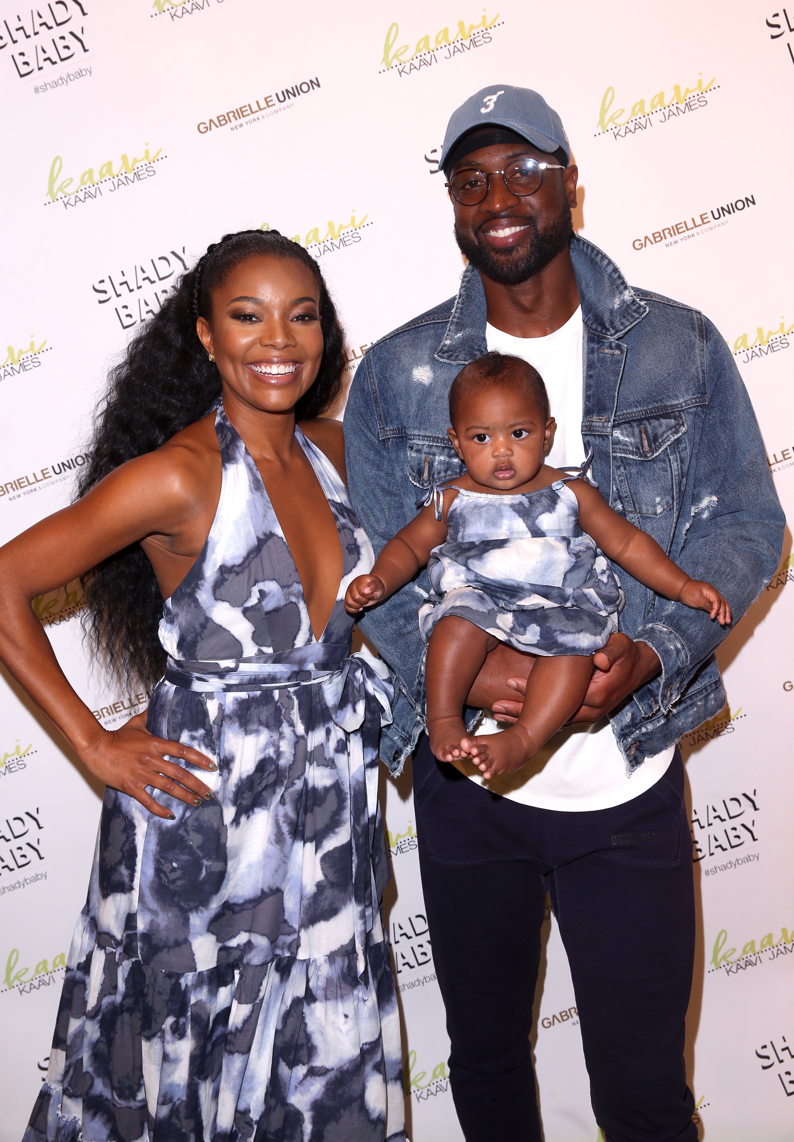 Gabrielle Union and husband Dwayne Wade with daughter Kaavia James as they visit New York & Company Store in Burbank, California on May 9, 2019 | Photo: Getty Images