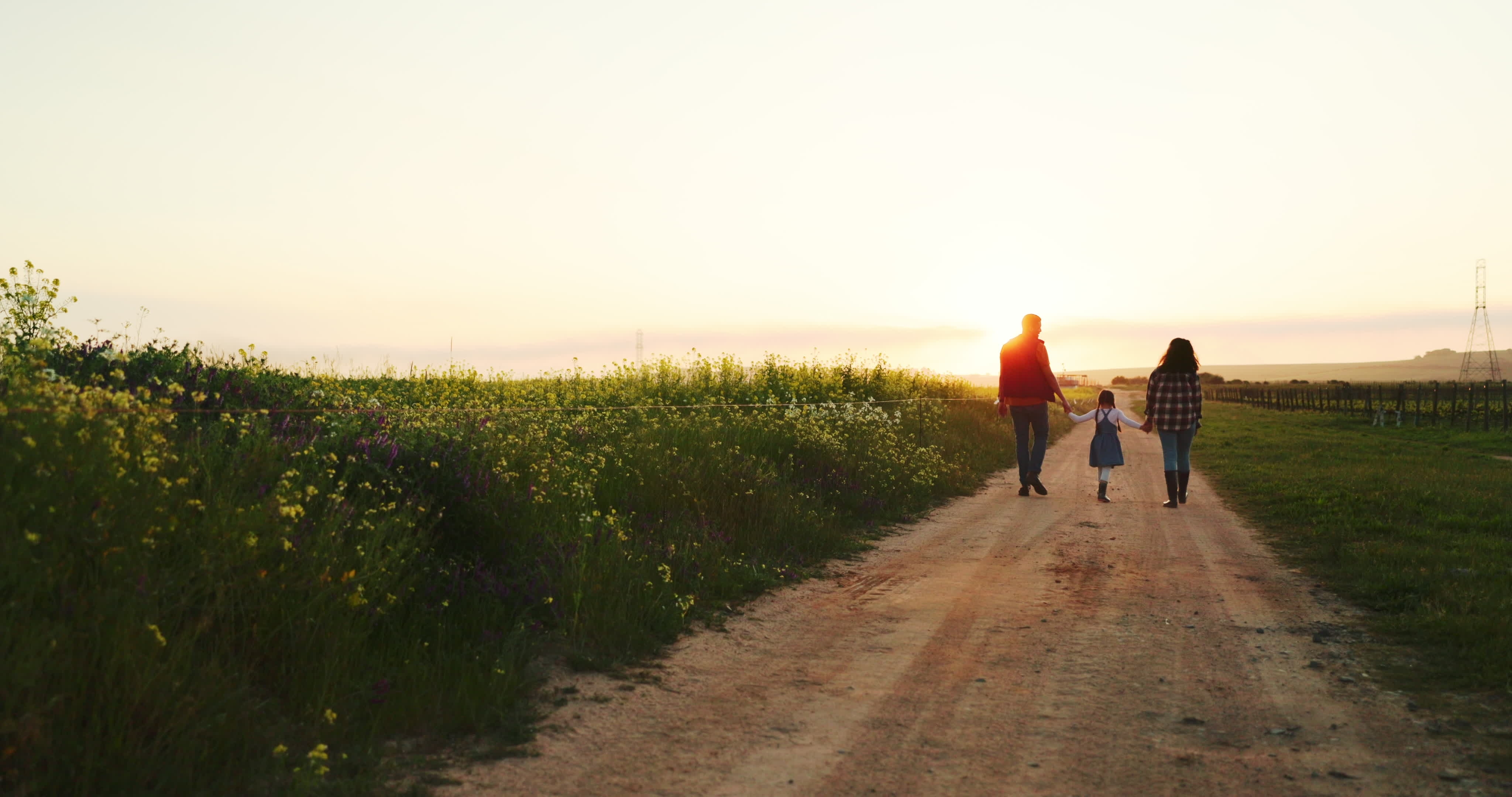 Happy family walk along the path | Source: Shutterstock.com