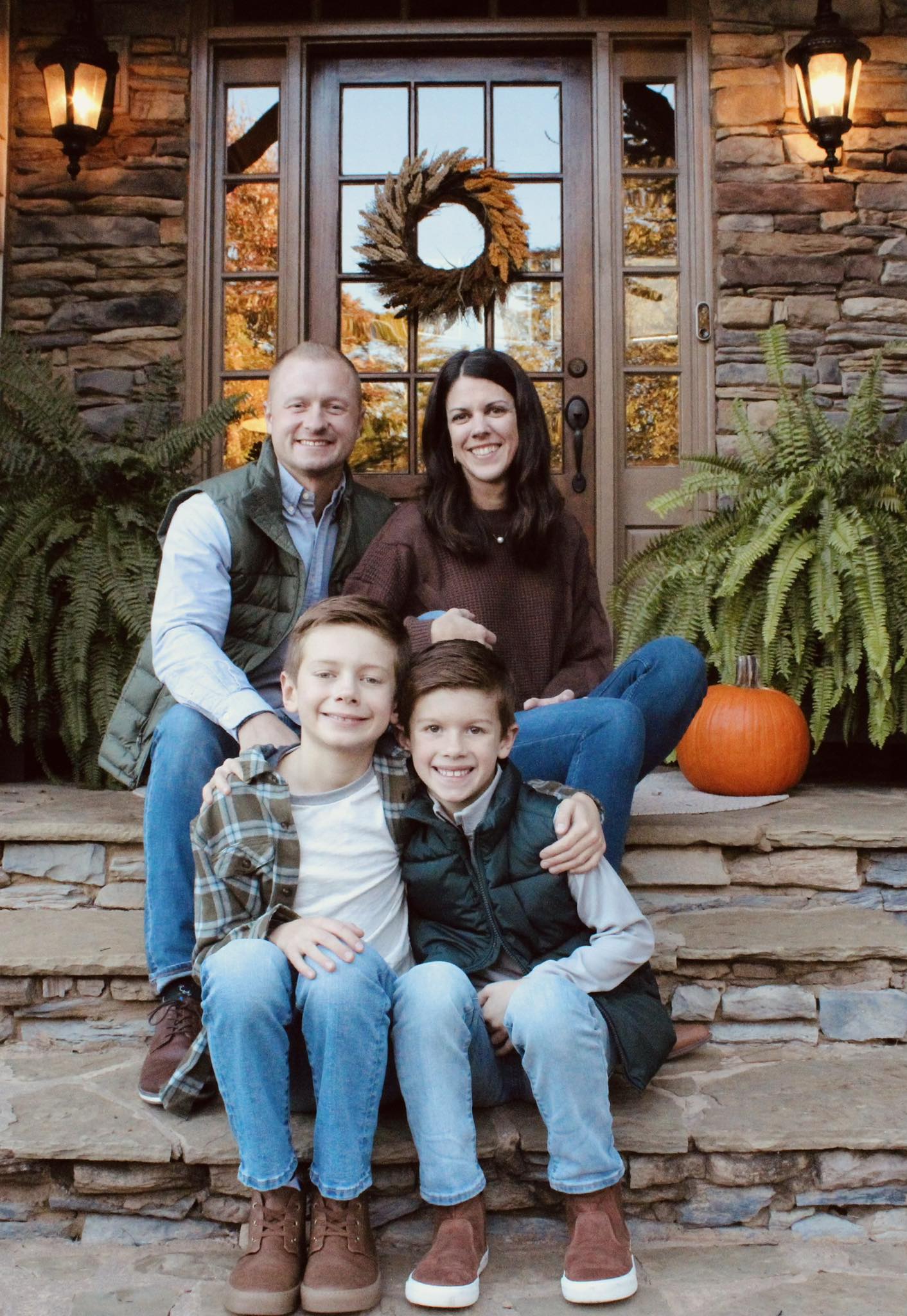 Jason, Laura, and their sons Owen and Luke Hughes posing on a porch, from a post dated March 1, 2024 | Source: Facebook/Jason Hughes