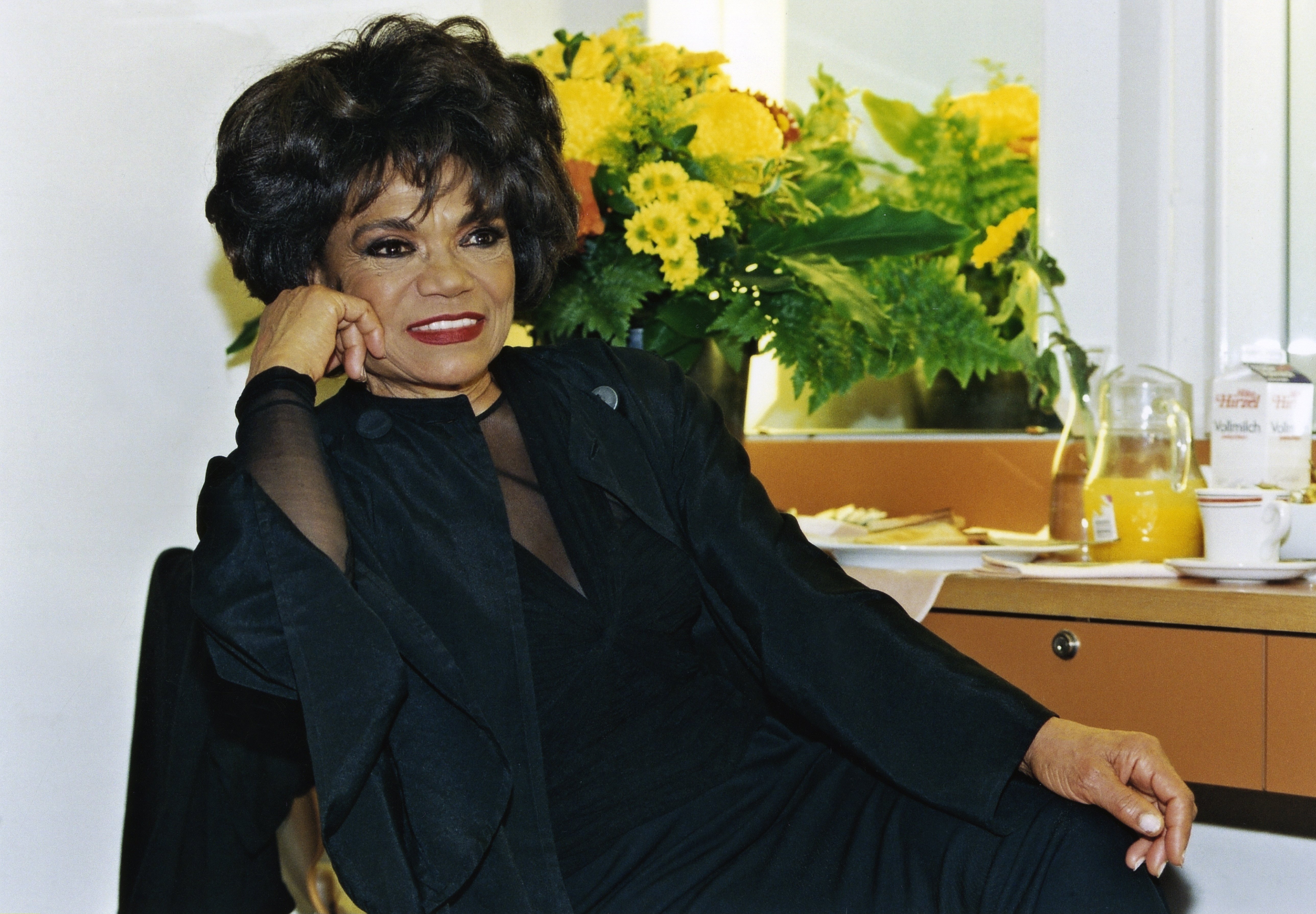A photograph of "Santa Baby" singer Eartha Kitt looking away while smiling | Photo: Getty Images