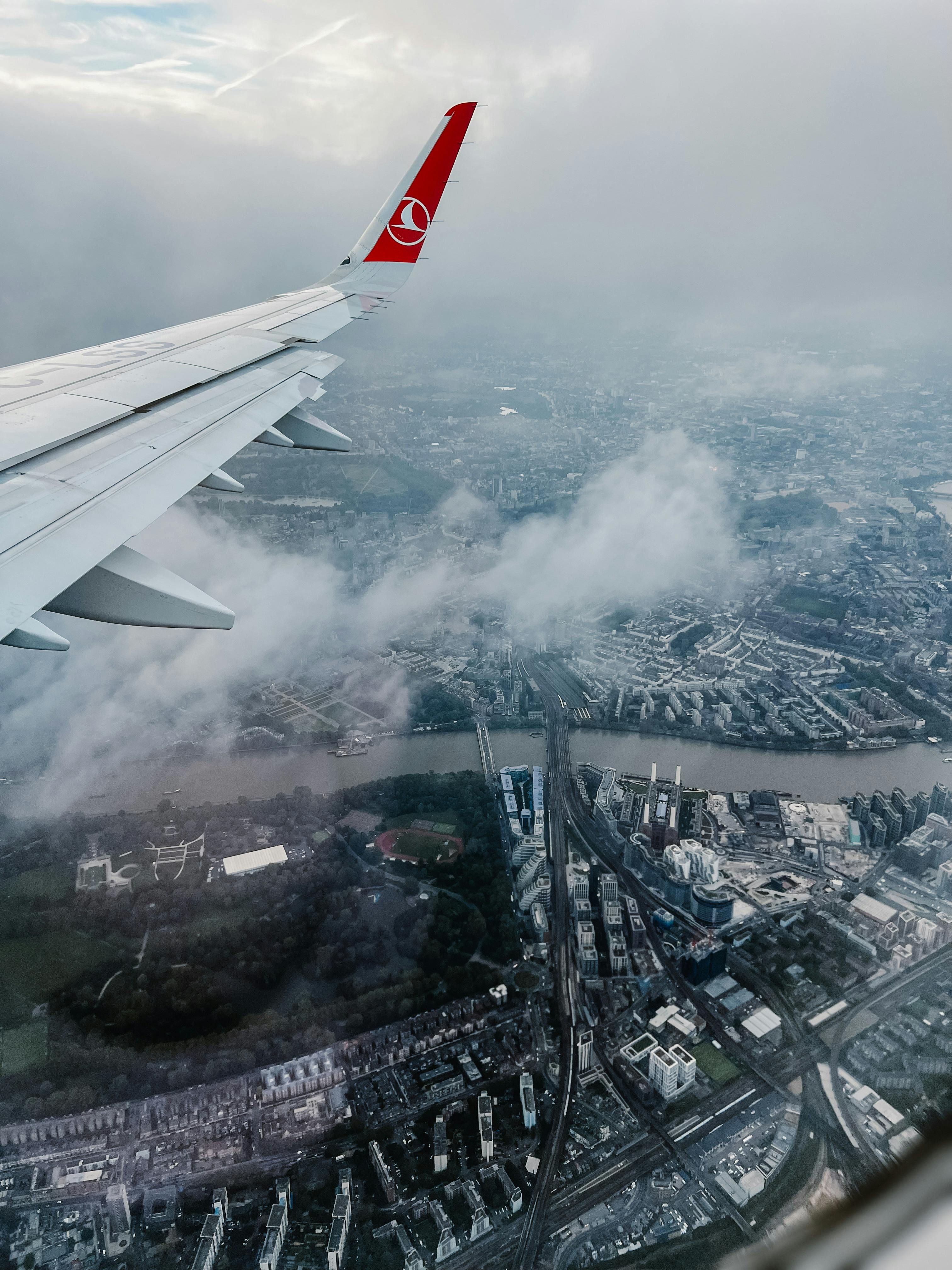 An airplane descending towards an airport | Source: Pexels