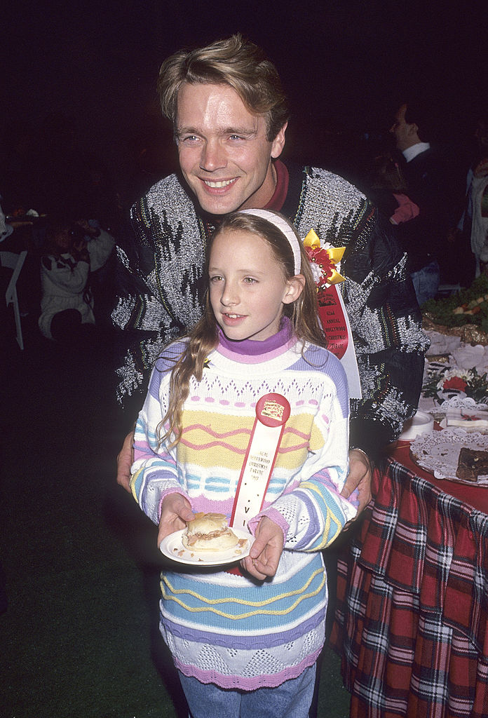 John Schneider and stepdaughter Leah Castle at the 62nd Annual Hollywood Christmas Parade at KTLA Studios in Hollywood, California, 1993| Source: Ron Galella, Ltd./Ron Galella Collection via Getty Images