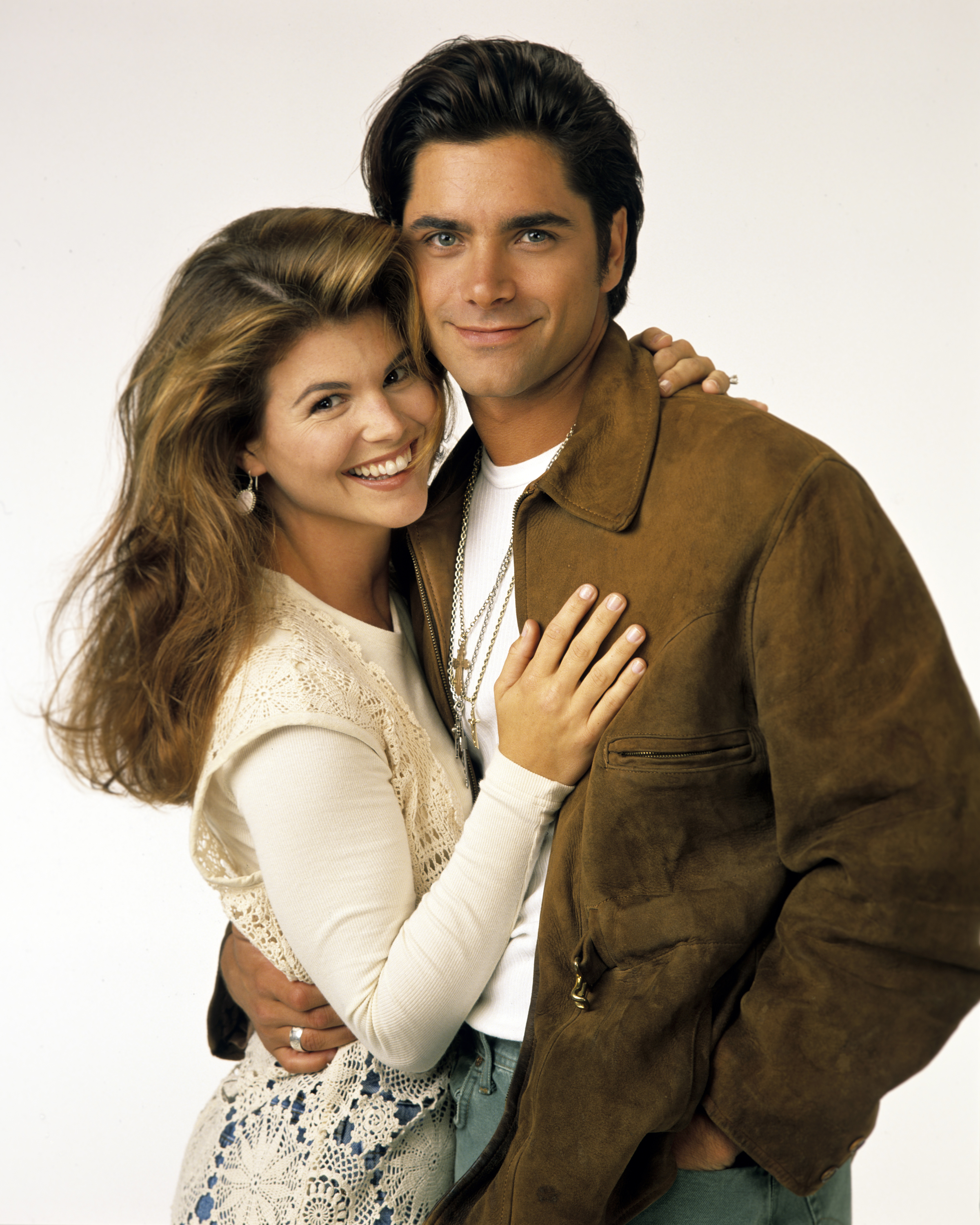 Lori Loughlin and John Stamos's promotional photo for the ABC tv series "Full House" on August 30, 1993. | Source: Getty Images