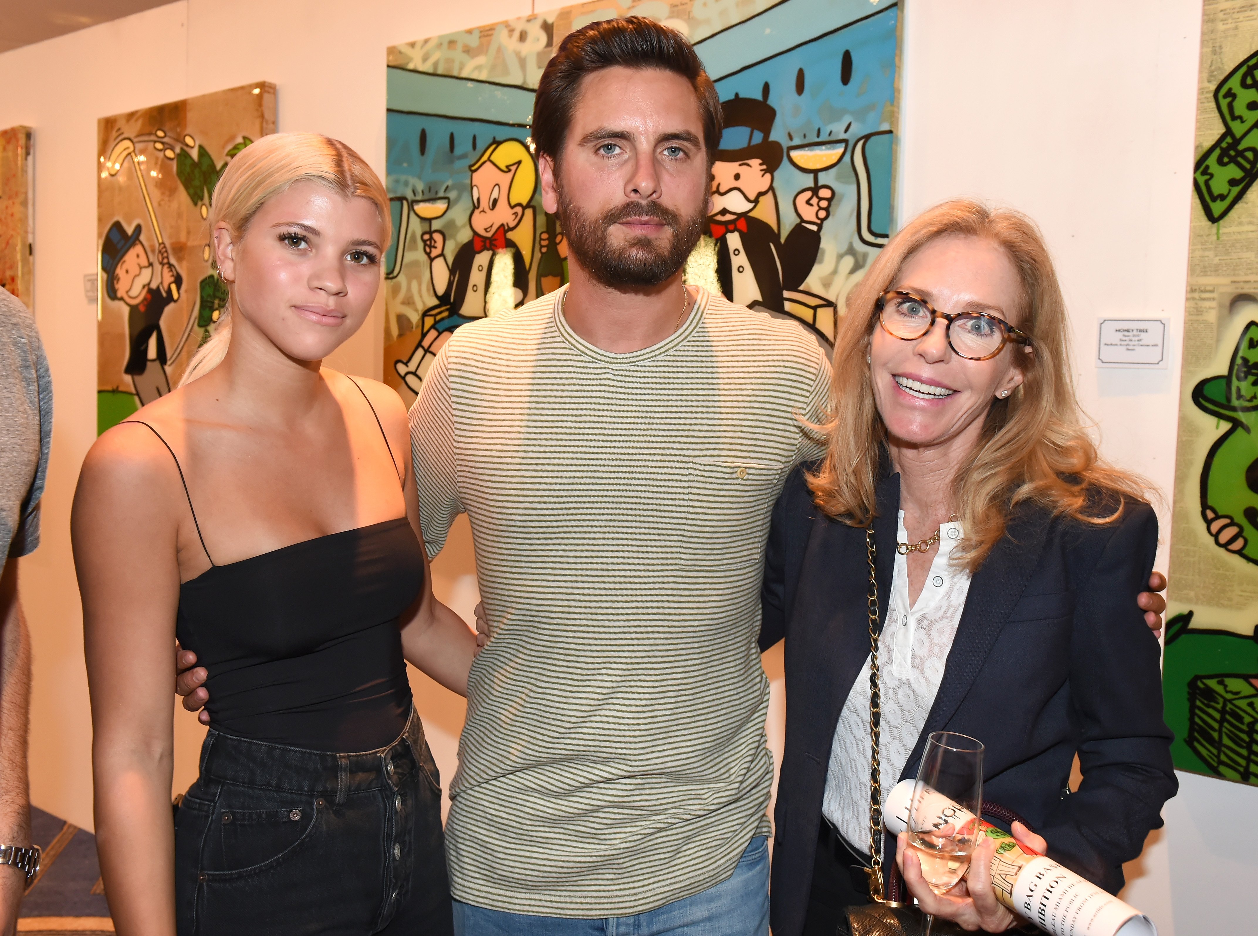 Sofia Richie, Scott Disick, and Alexandra Andon attend the opening of an art gallery at Fleur de Lis Ballroom in Miami Beach, Florida on December 7, 2017 | Photo: Getty Images