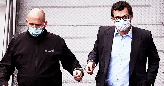 Simon Bowes-Lyon, the the Earl of Strathmore, leaves Dundee Sheriff Court in handcuffs on February 23, 2021 | Photo: Getty Images