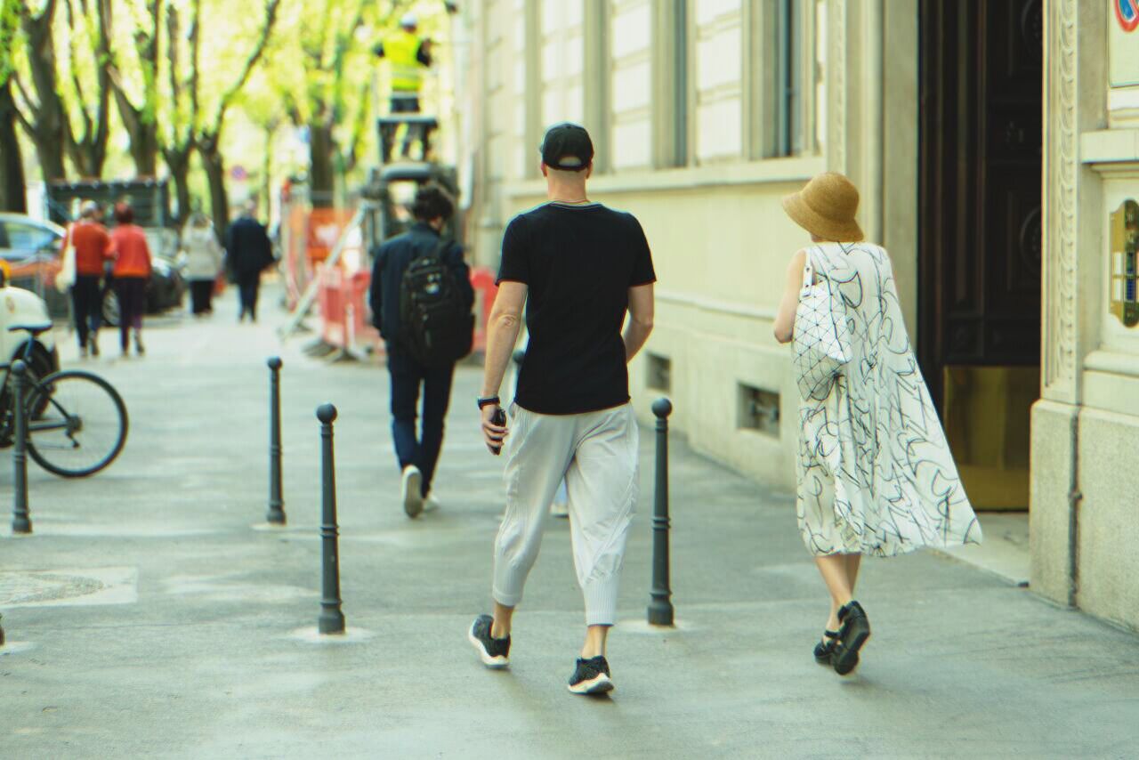 Couple walking down the street | Source: Shutterstock