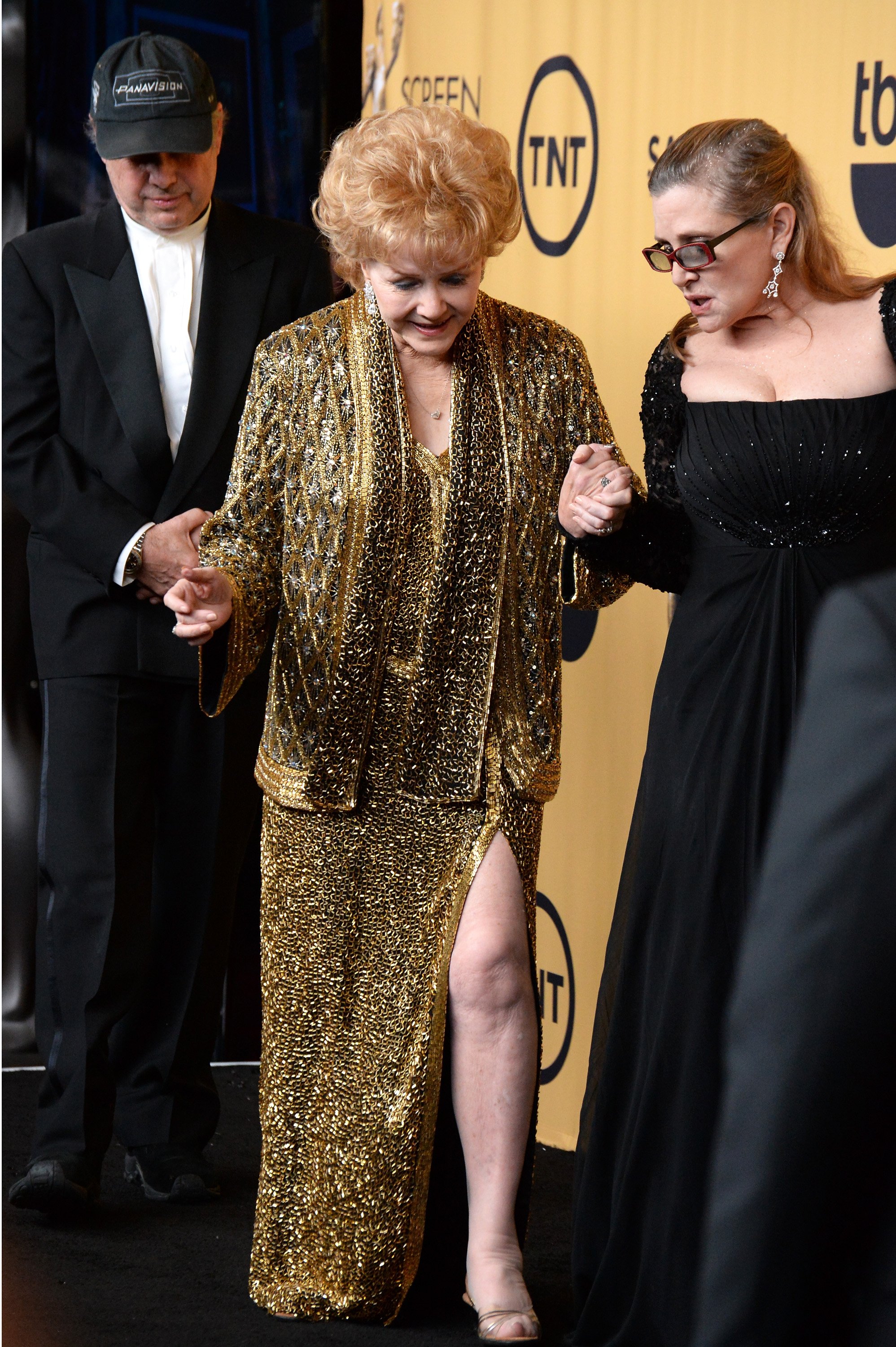 Todd Fisher, honoree Debbie Reynolds and actress Carrie Fisher pose in the press room at the 21st Annual Screen Actors Guild Awards at The Shrine Auditorium on January 25, 2015 in Los Angeles, California. | Source: Getty Images