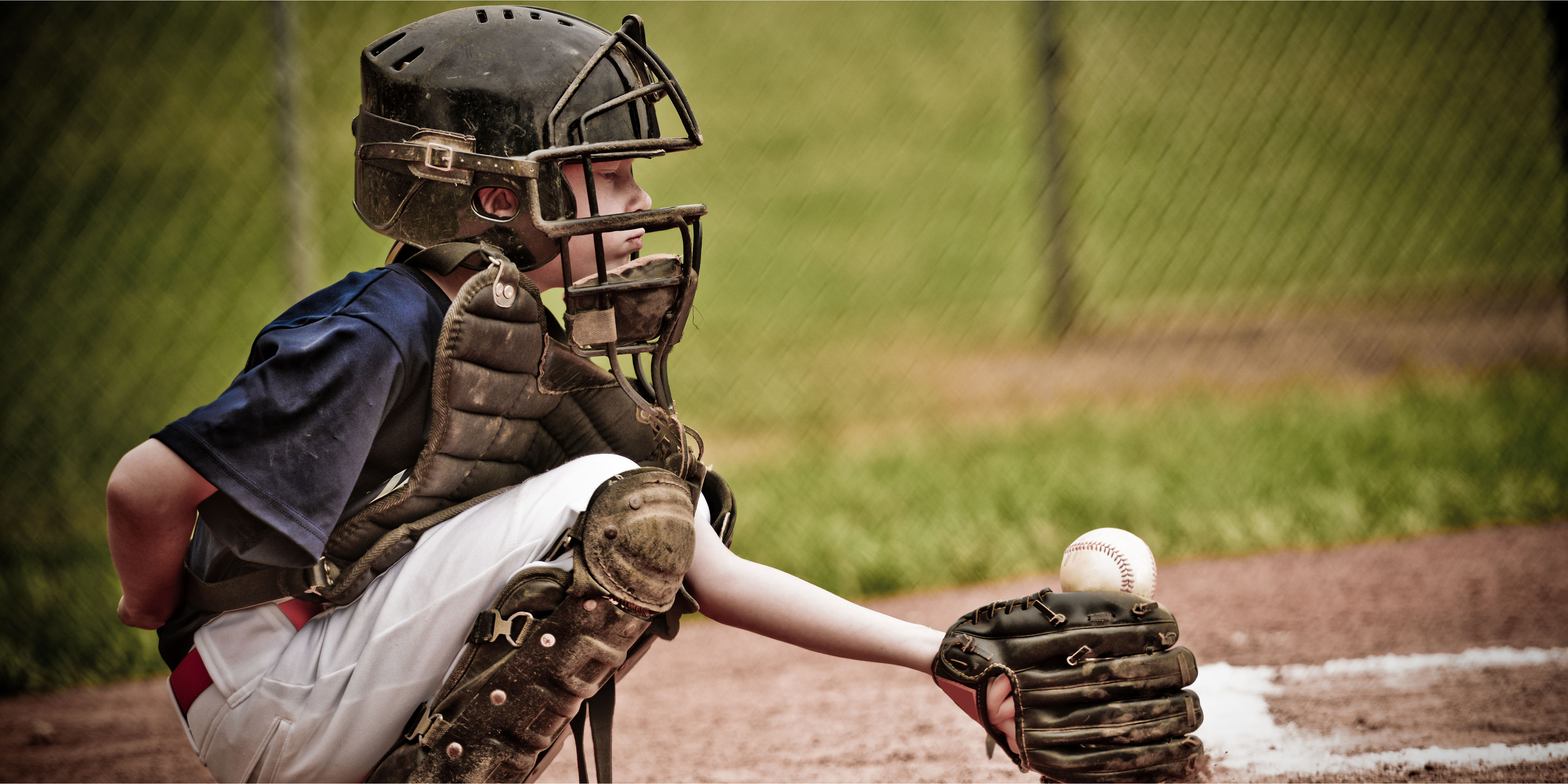 Boy playing baseball. | Source: Shutterstock