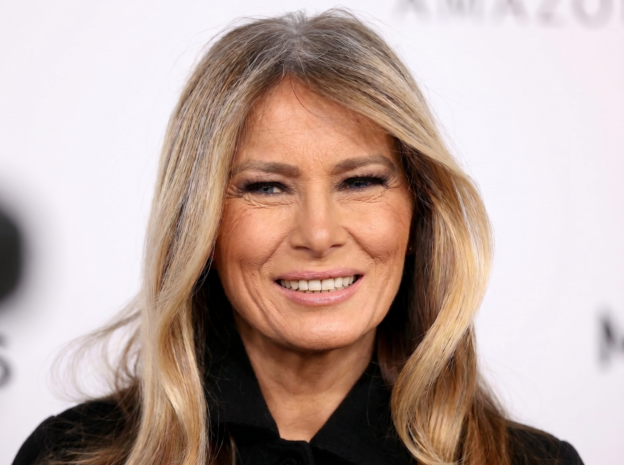 This AI-generated image depicts a version of Melania Trump aged naturally, with more visible wrinkles around the eyes, forehead, and mouth while retaining many of her recognizable facial features. | Source: Gemini