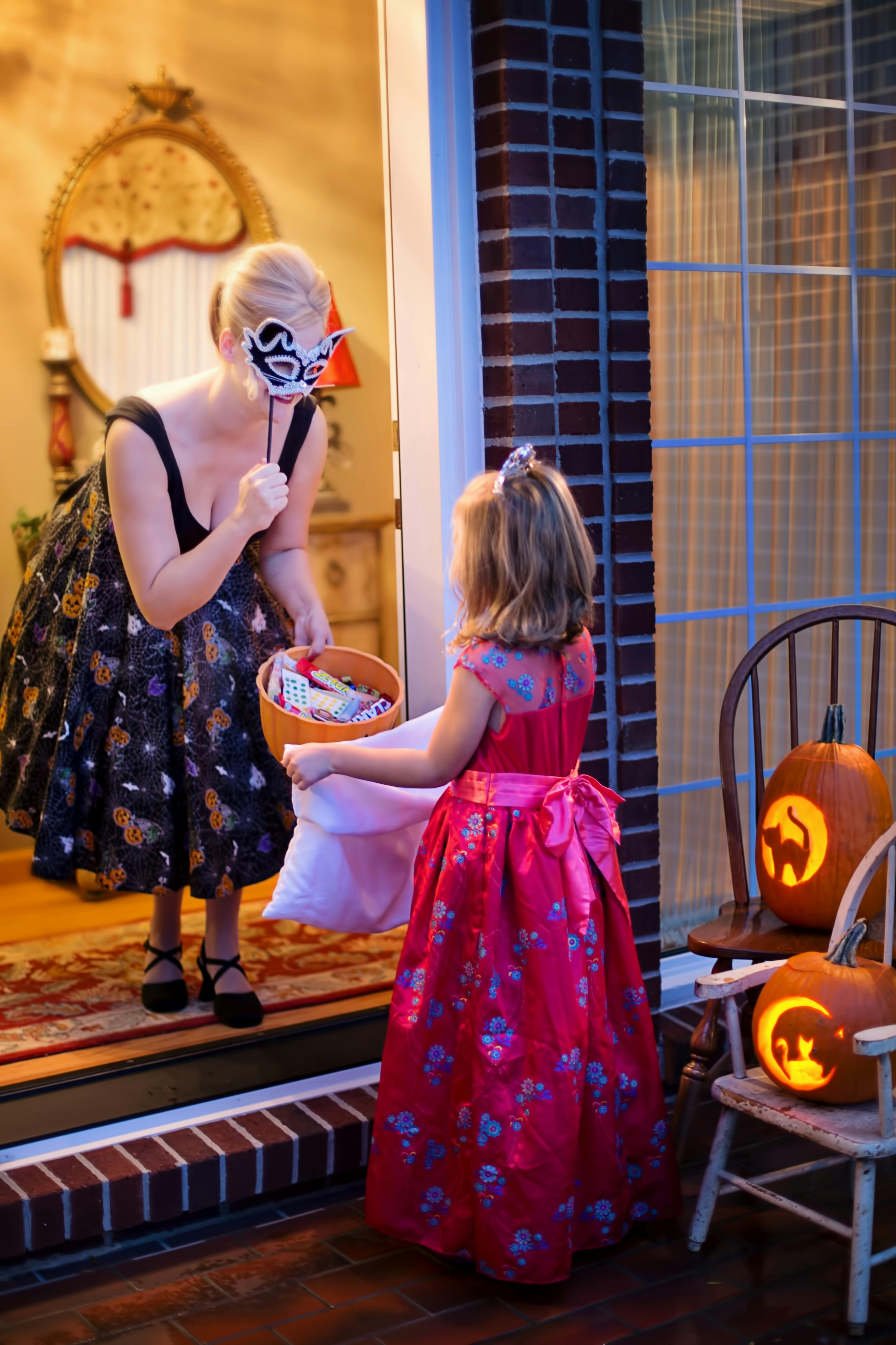 Giving candies on Halloween | Source: Pexels