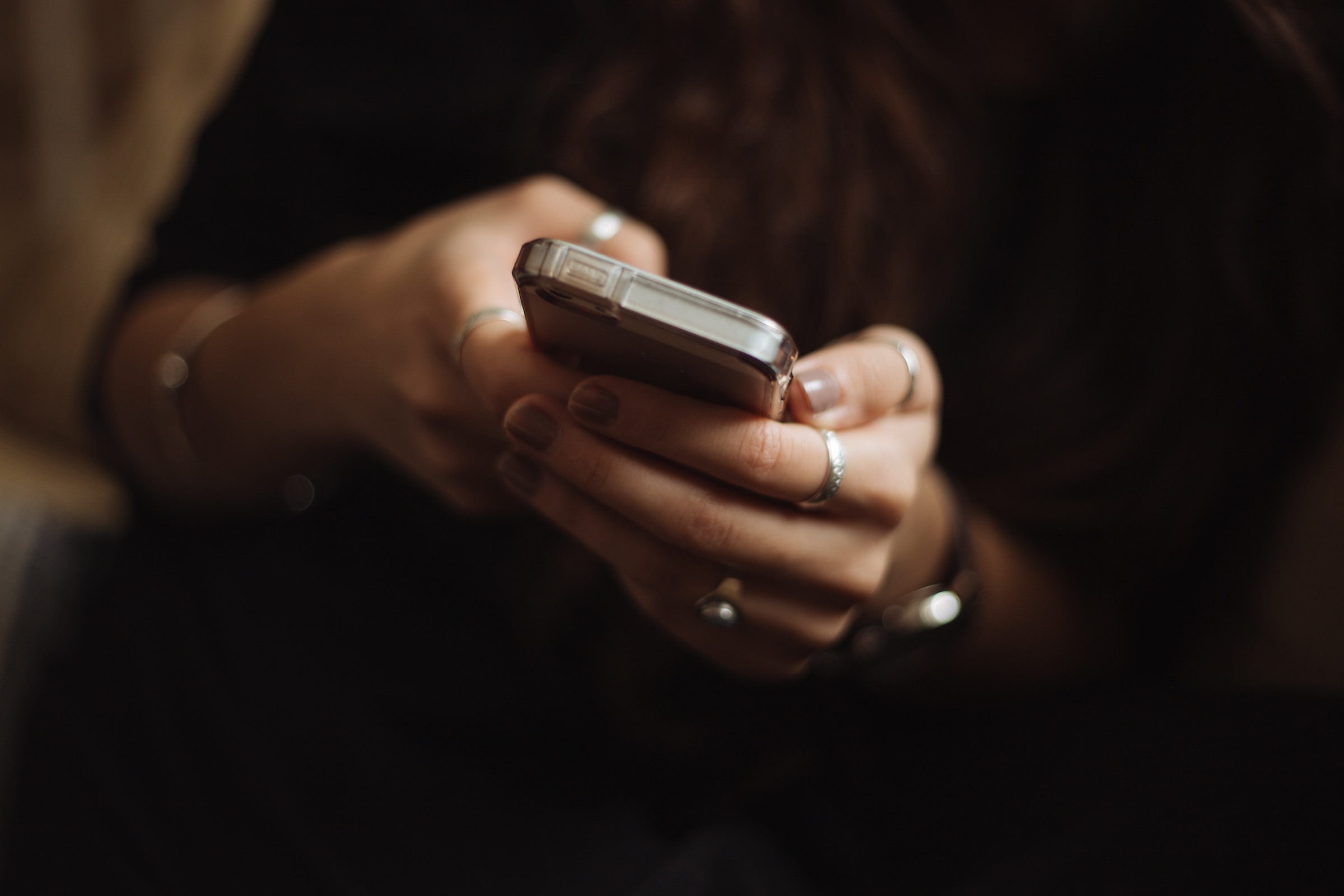 Woman holding a phone | Source: Unsplash