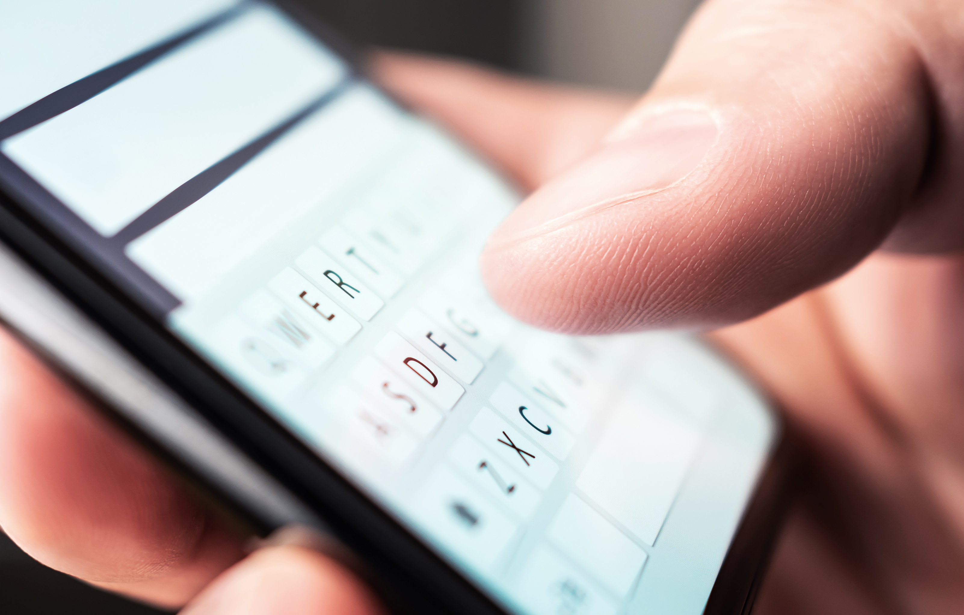 A man using a smart phone | Source: Shutterstock