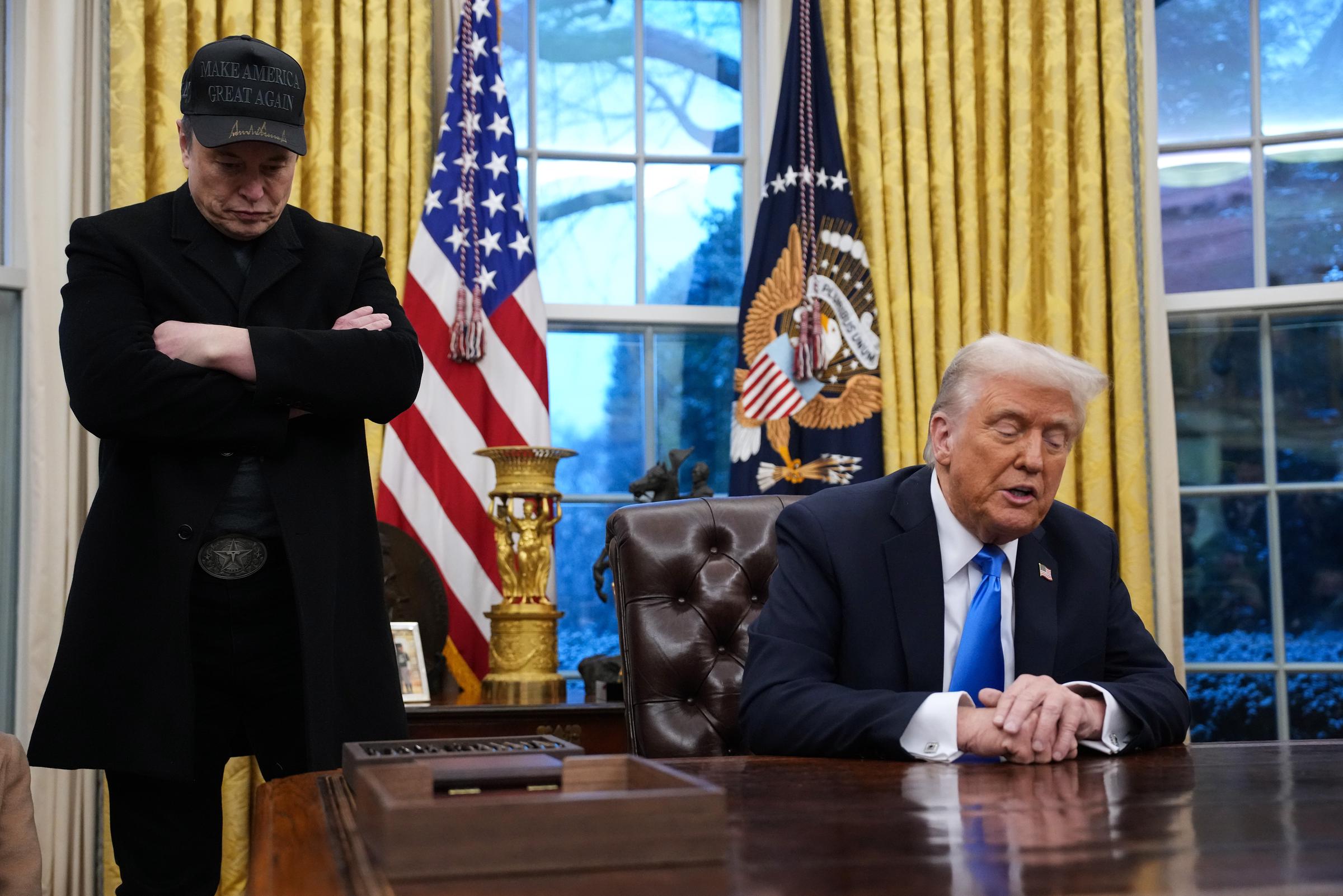 Elon Musk and President Donald Trump during an executive order signing in the Oval Office of the White House in Washington, D.C., on February 11, 2025. | Source: Getty Images