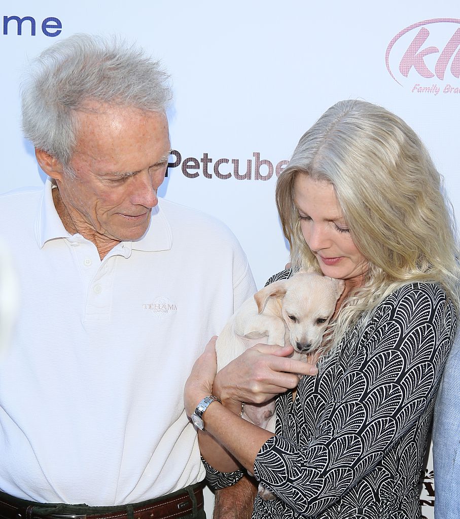 Clint Eastwood and Christina Sandera at the 1st annual Fall Garden Party Animal Rescue Fundraiser hosted by Eastwood Ranch Foundation at Malibu Family Wines in Malibu, California, on November 7, 2015 | Source: Getty Images