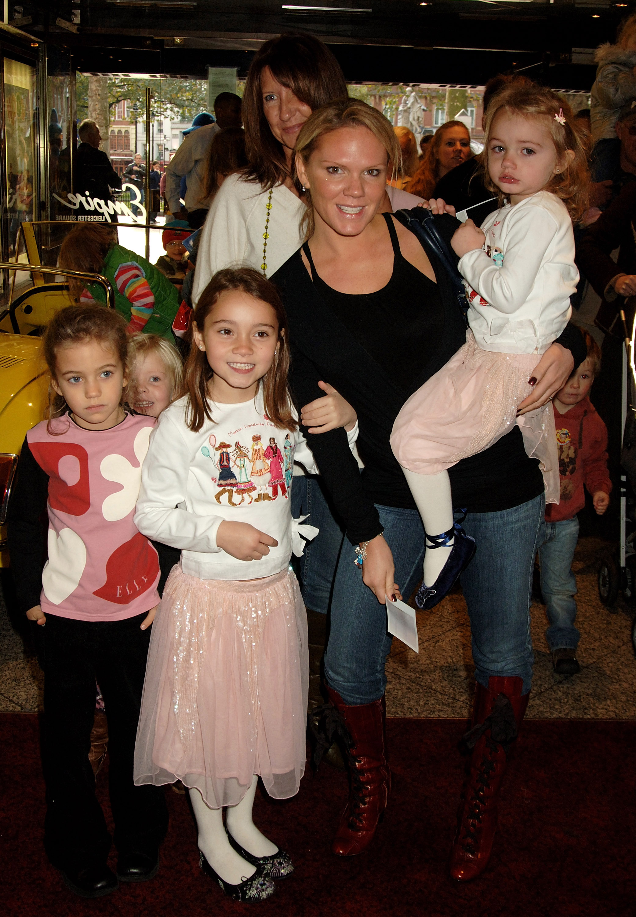 Louise Adams and her daughters Liberty (L), Talula (R), and other children at the Charity DVD premiere for "Noddy and the Island Adventure" on October 23, 2005, in London, England | Source: Getty Images