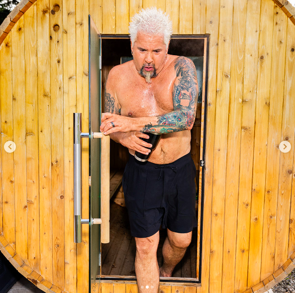 Guy Fieri stepping out of a sauna, posted on May 14, 2024 | Source: Instagram/menshealthmag and guyfieri