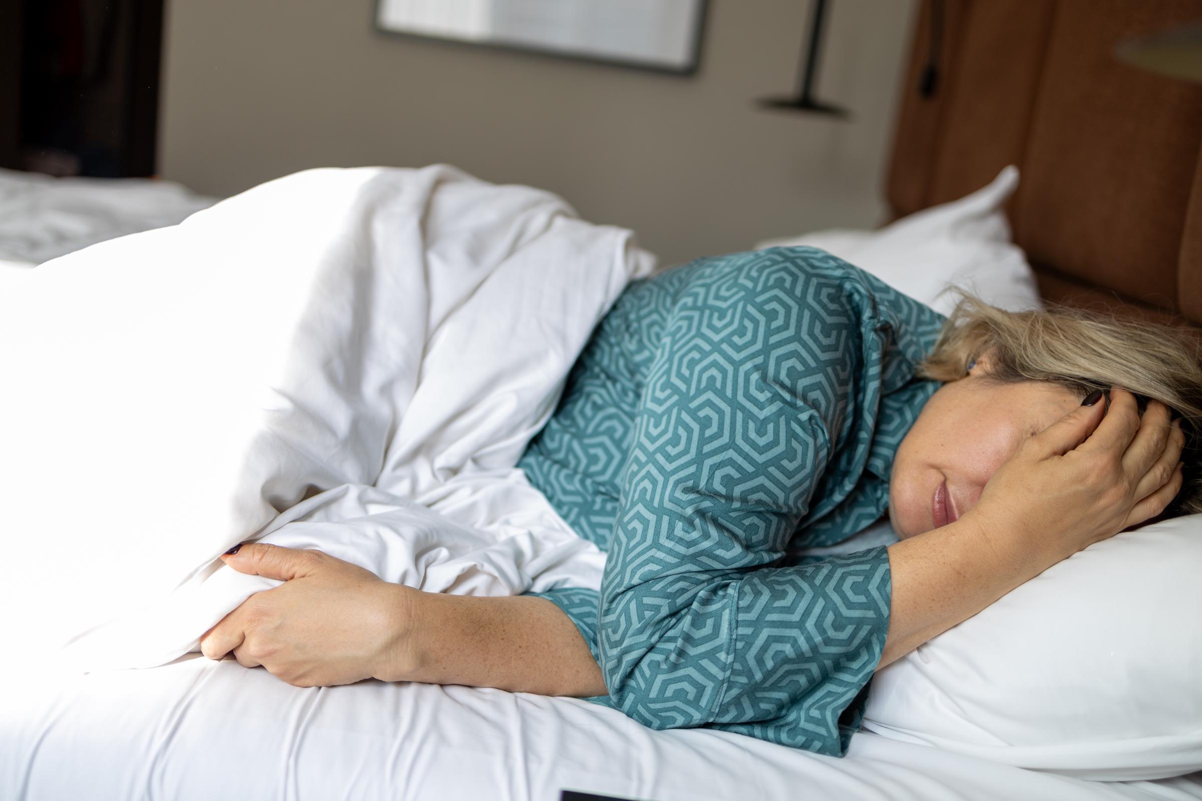 A woman sleeping in her bed | Source: Getty Images