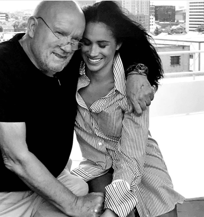 The Duchess of Sussex smiles sweetly with photographer Peter Lindbergh | Getty Images