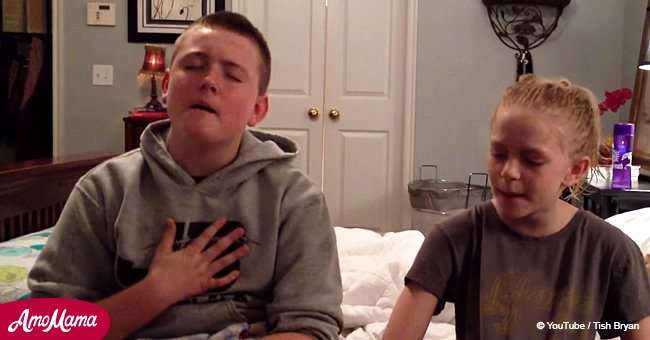 Siblings sing emotional song but little brother behind them steals the spotlight