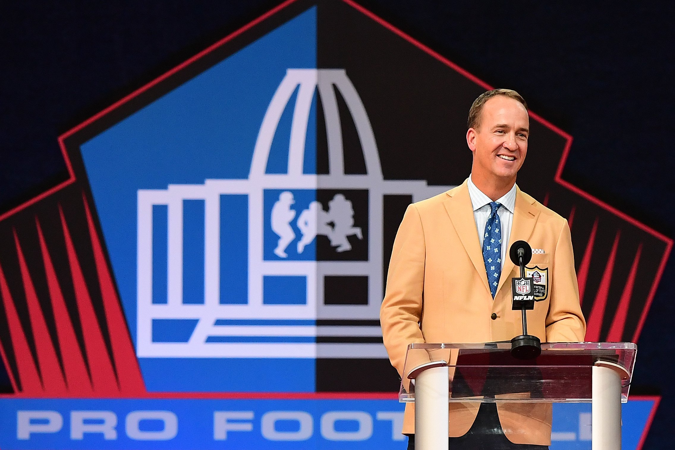 Peyton Manning reacts to the crowd during the NFL Hall of Fame Enshrinement Ceremony at Tom Benson Hall Of Fame Stadium on August 08, 2021, in Canton, Ohio. | Source: Getty Images