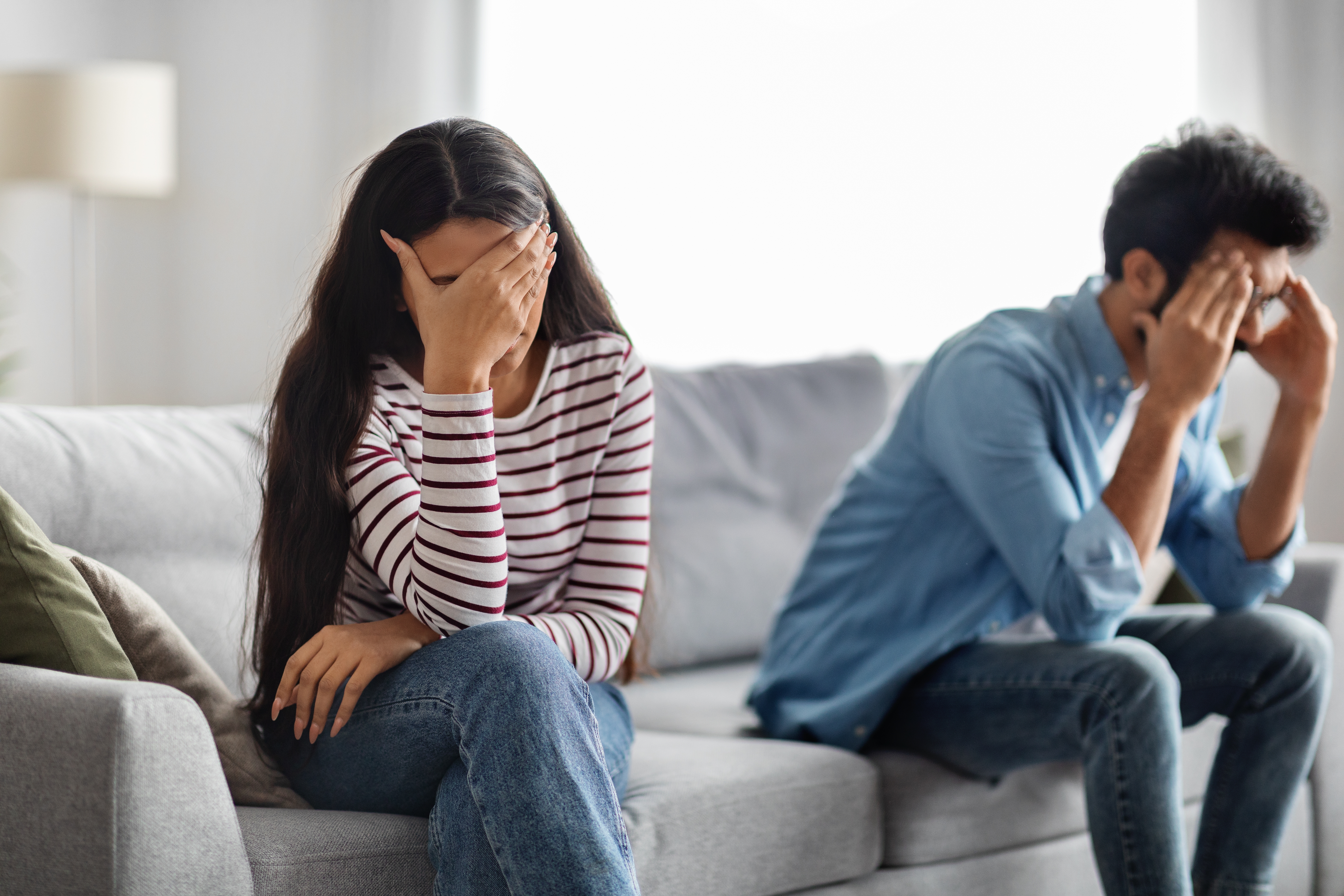 Unhappy young middle eastern couple have quarrel at home| Source: Shutterstock.com