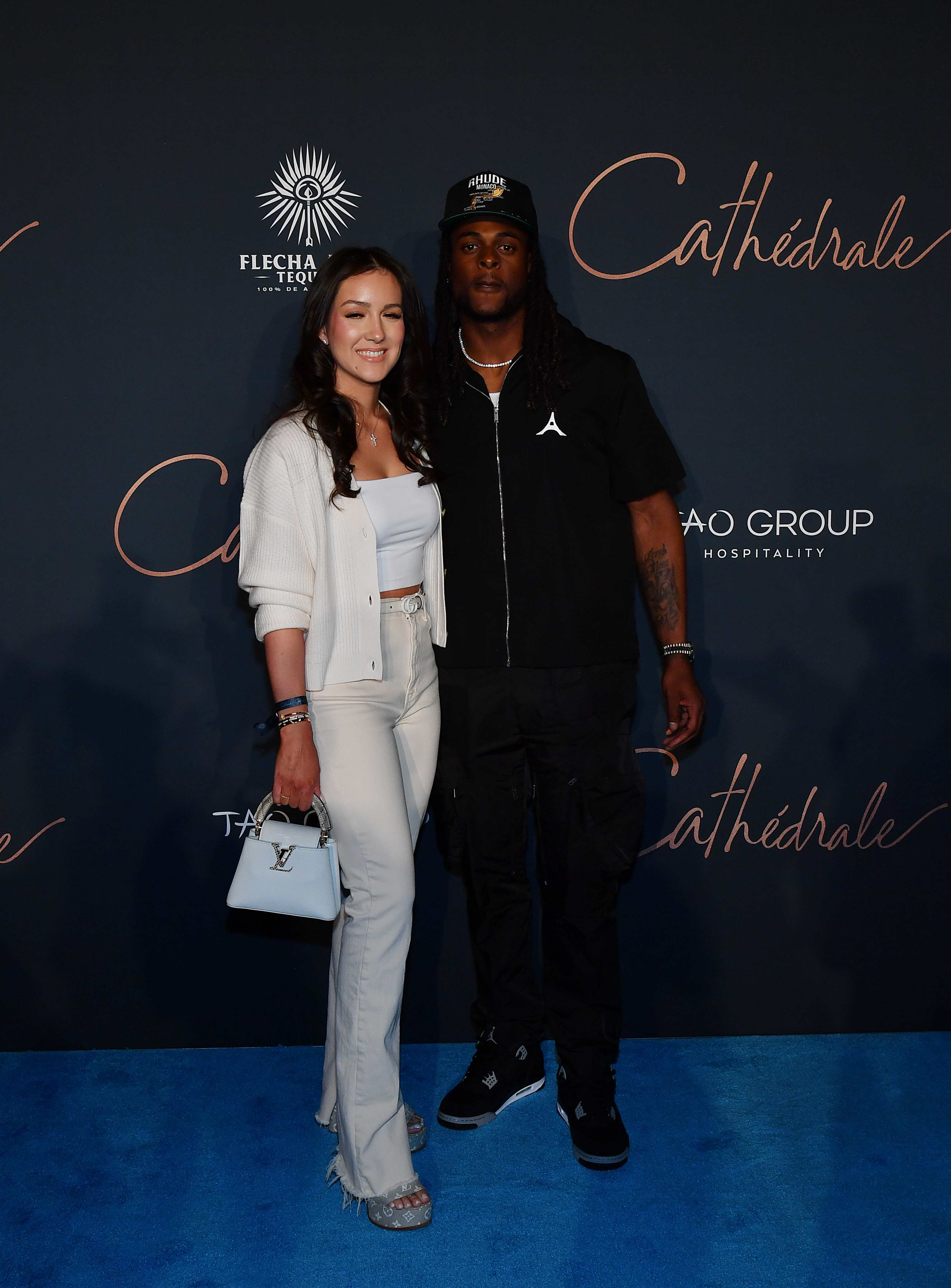 Devanne Villarreal and Davante Adams at the grand opening of Cathédrale Restaurant at ARIA Resort & Casino on April 29, 2023 in Las Vegas, Nevada. |  Source: Getty Images