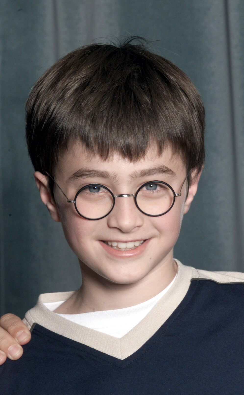 The boy at a press conference for the movie "Harry Potter and The Philosopher's Stone" in London on August 23, 2000 | Source: Getty Images