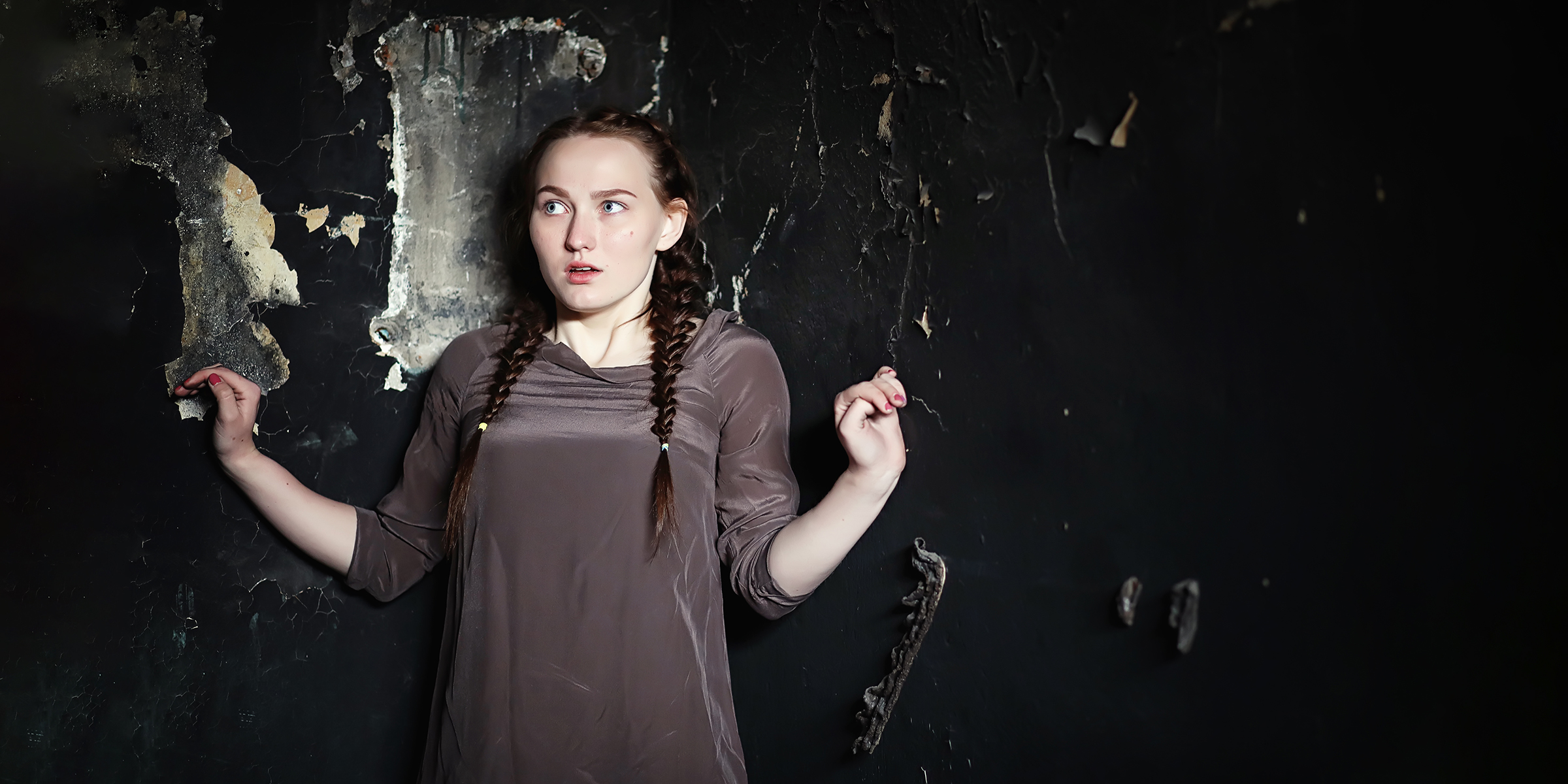 A woman staring at something in shock | Source: Shutterstock