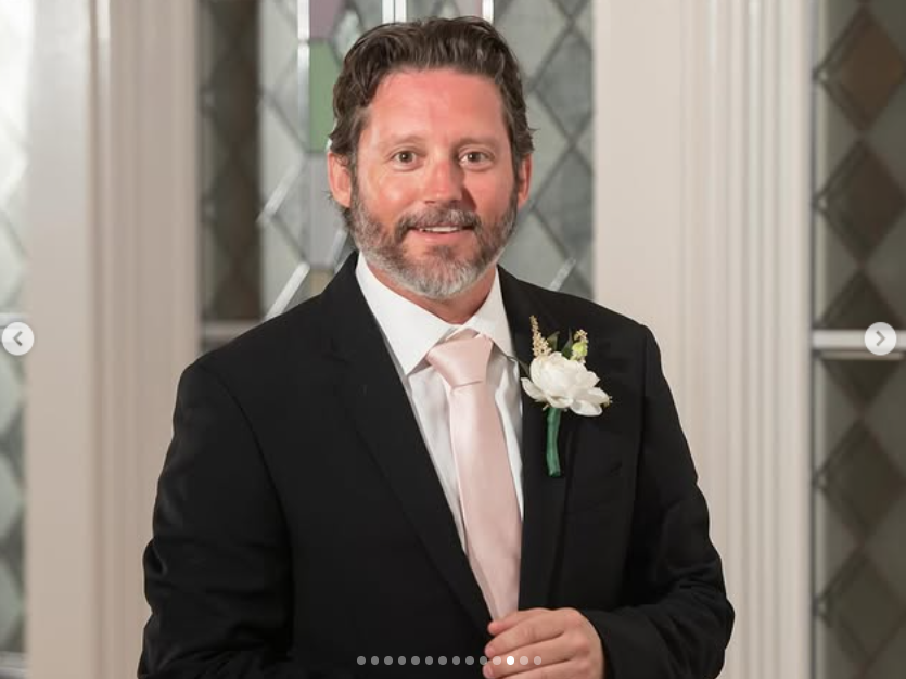 Brandon Blackstock dressed in a suit with a white boutonnière, as posted on August 8, 2025 | Source: Instagram/shelbyblackstock