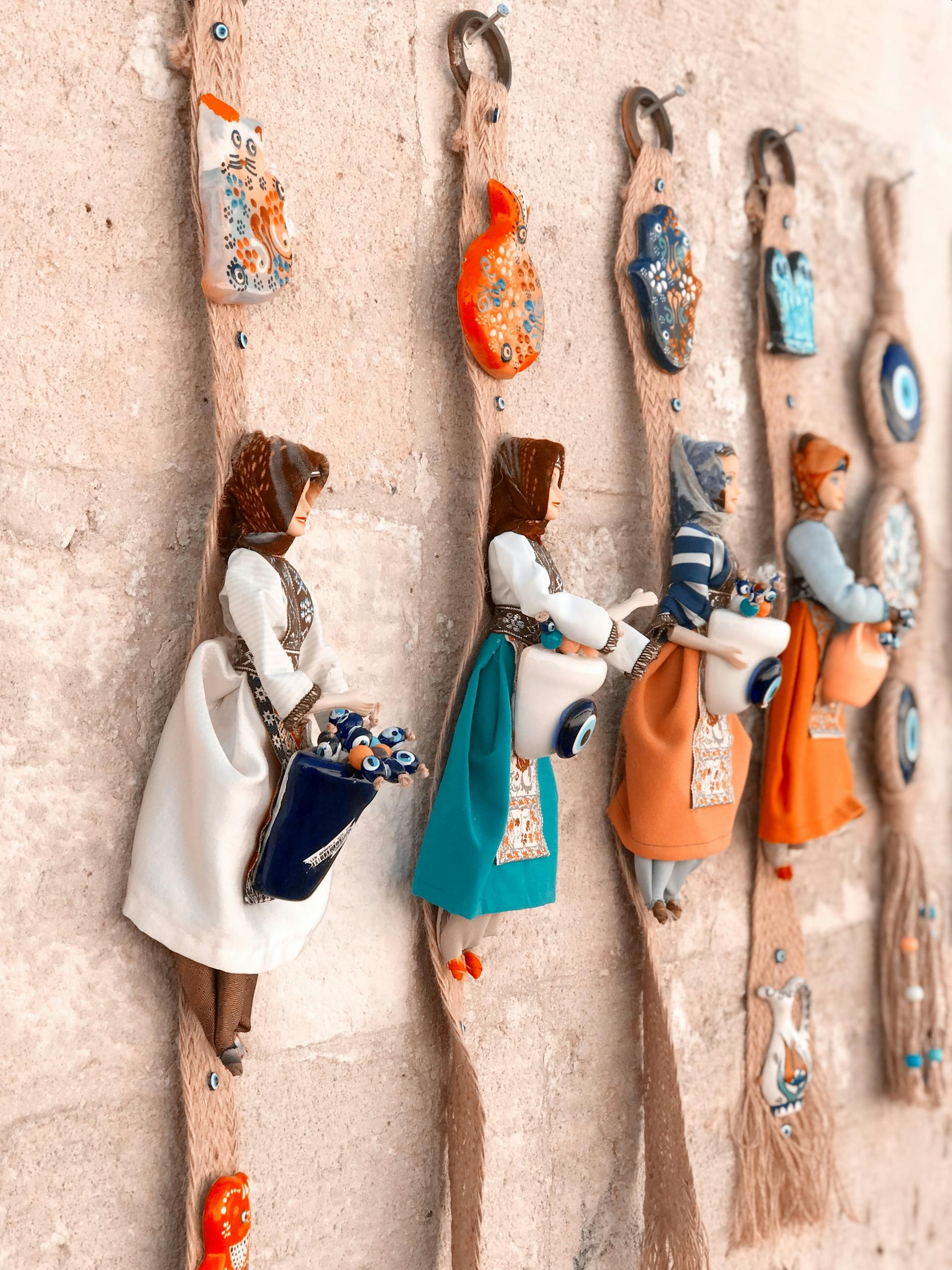 Dolls on a wall | Source: Pexels