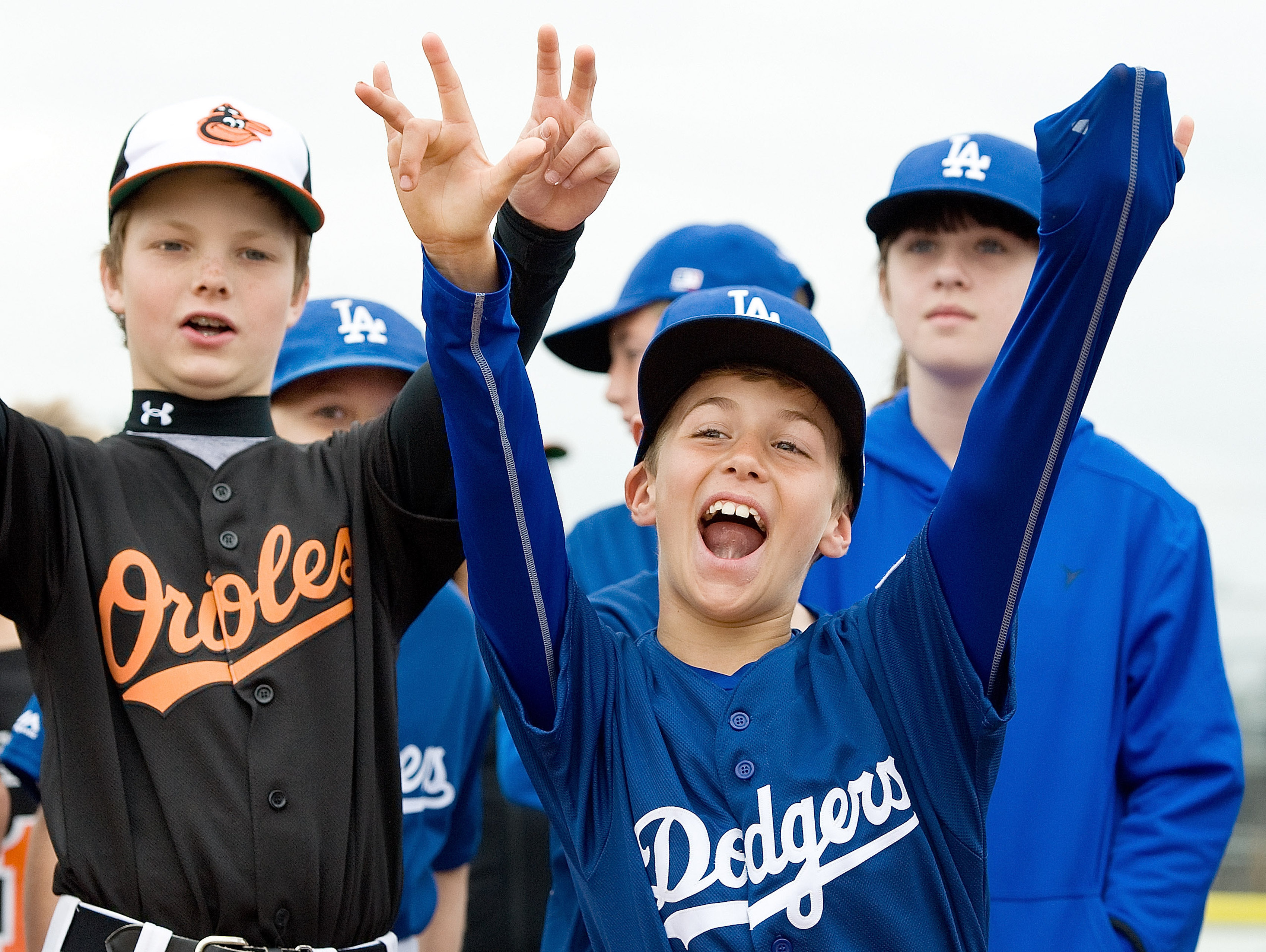 Dodgers player Jacob Fenton, 9, is pumped during opening day ceremonies for Tustin Western Little League in Orange County on February 21, 2015 | Source: Getty Images