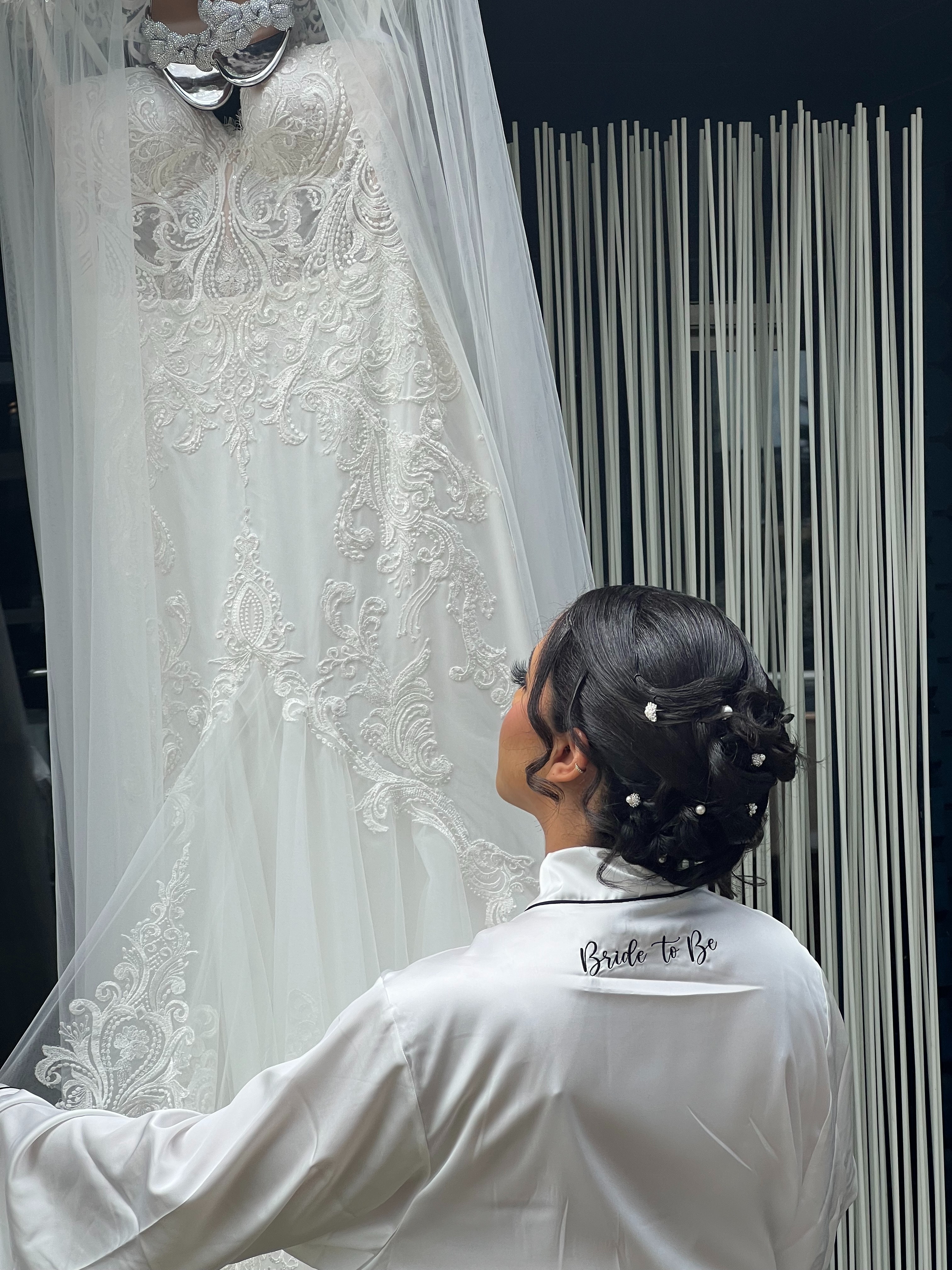 Woman looking at wedding dress | Source: Pexels