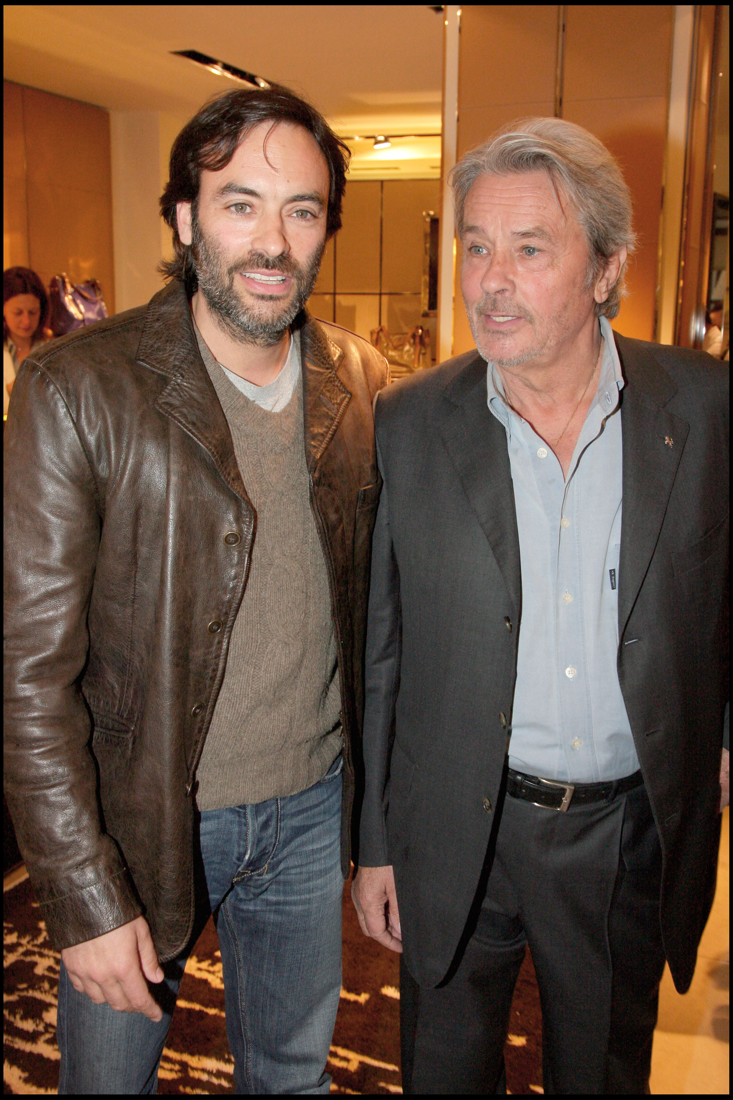 Anthony and Alain Delon at the Cocktail Party to celebrate The New Collection "G-Bag Tod's" at Tod's Boutique, on April 28, 2009 | Source: Getty Images