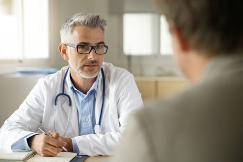 A doctor talking to his patient. | Source: Shutterstock.