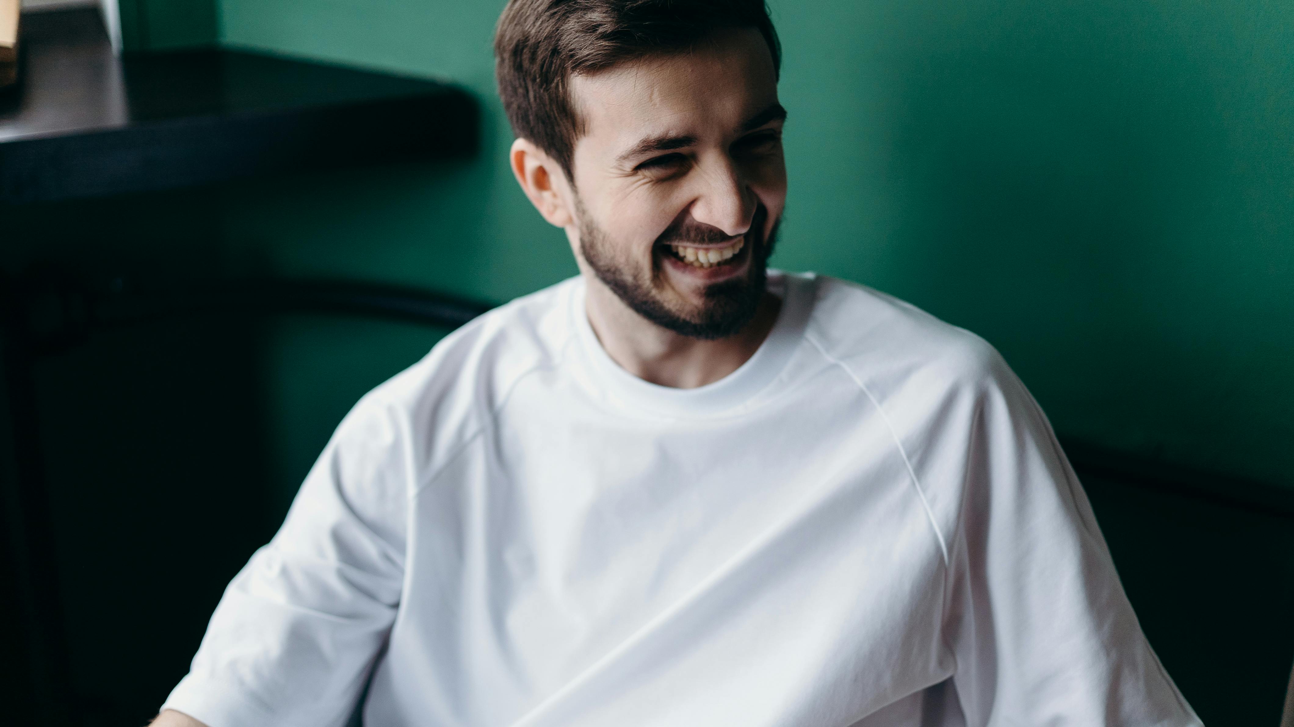 A smiling man at home | Source: Pexels