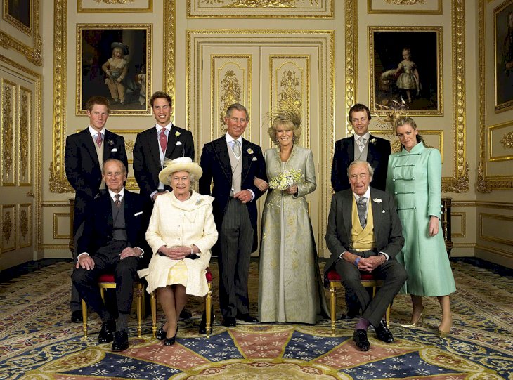 The Prince of Wales and his new bride Camilla, Duchess of Cornwall, with their families (L-R) back row Prince Harry, Prince William, Tom Parker Bowles and Laura Parker Bowles (L-R front row) Duke of Edinburgh, HM The Queen Elizabeth II and Camilla's father Major Bruce Shand, in the White Drawing Room at Windsor Castle Saturday April 9 2005, after their wedding ceremony. (Photo by Anwar Hussein Collection/ROTA/WireImage)