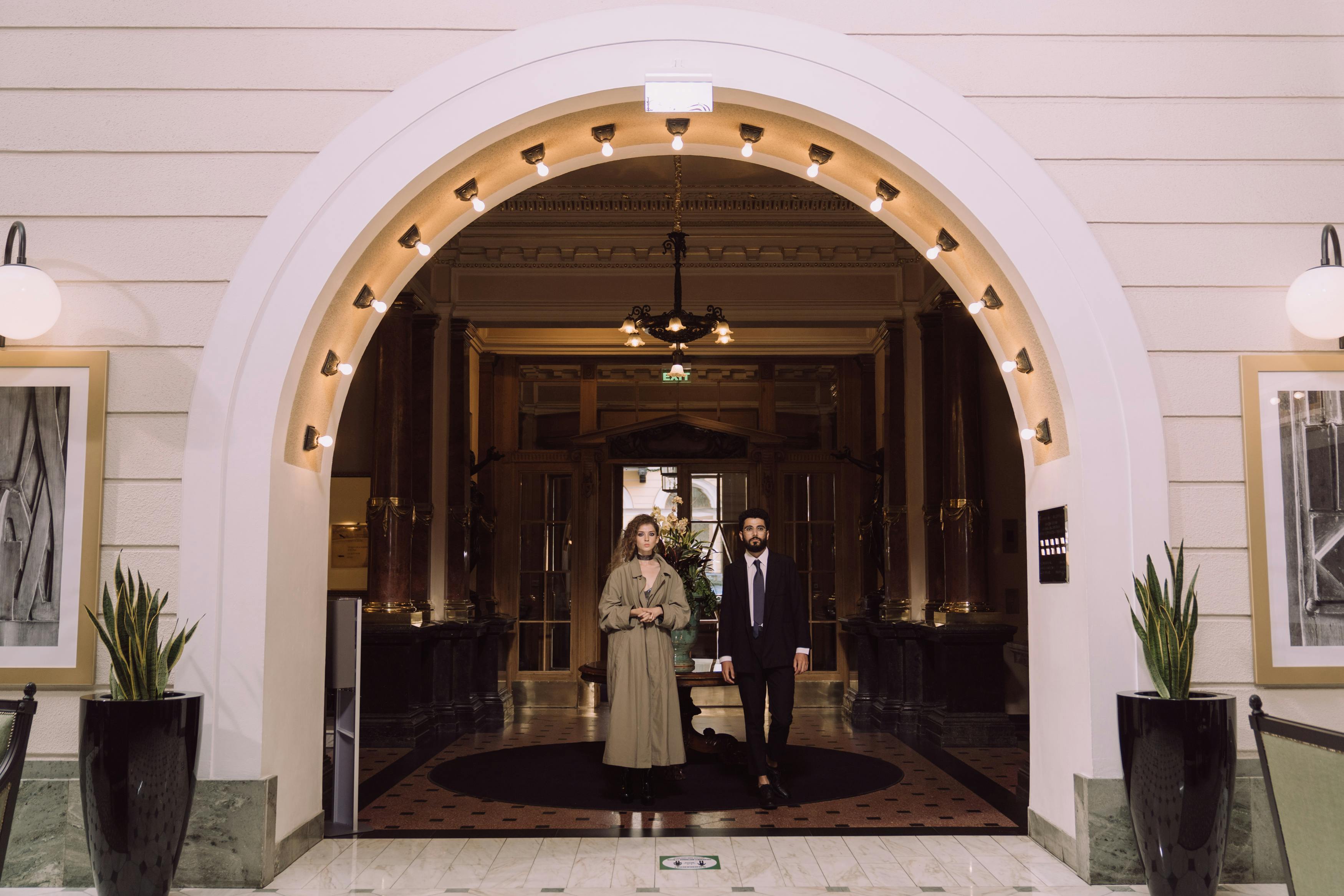 Two people standing at a hotel entrance | Source: Pexels