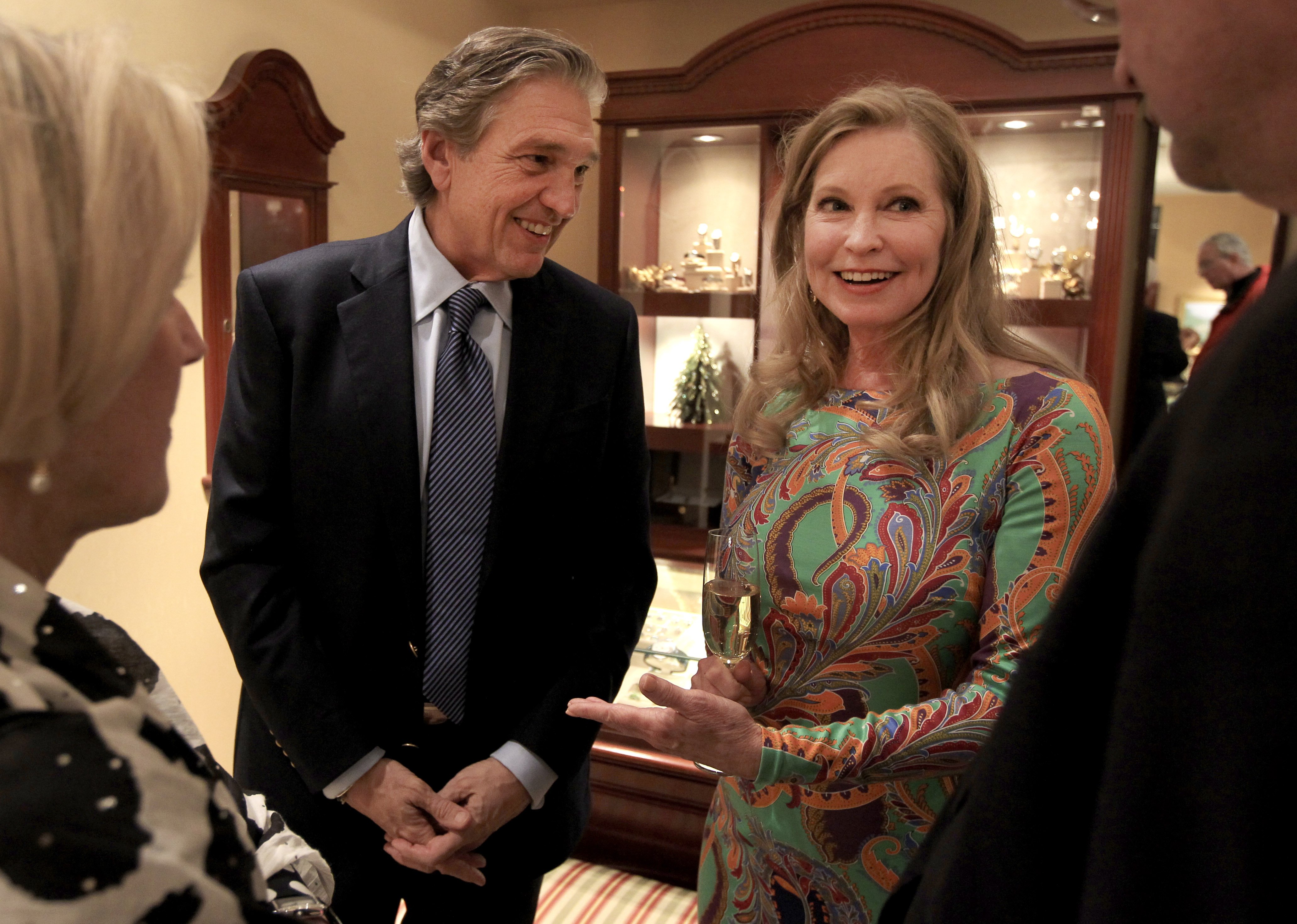 Albert DePrisco, left, and author, actor and director Lisa Niemi Swayze at a book signing event at DePrisco Jewelers in Wellesley on November 30, 2013. | Source: Getty Images