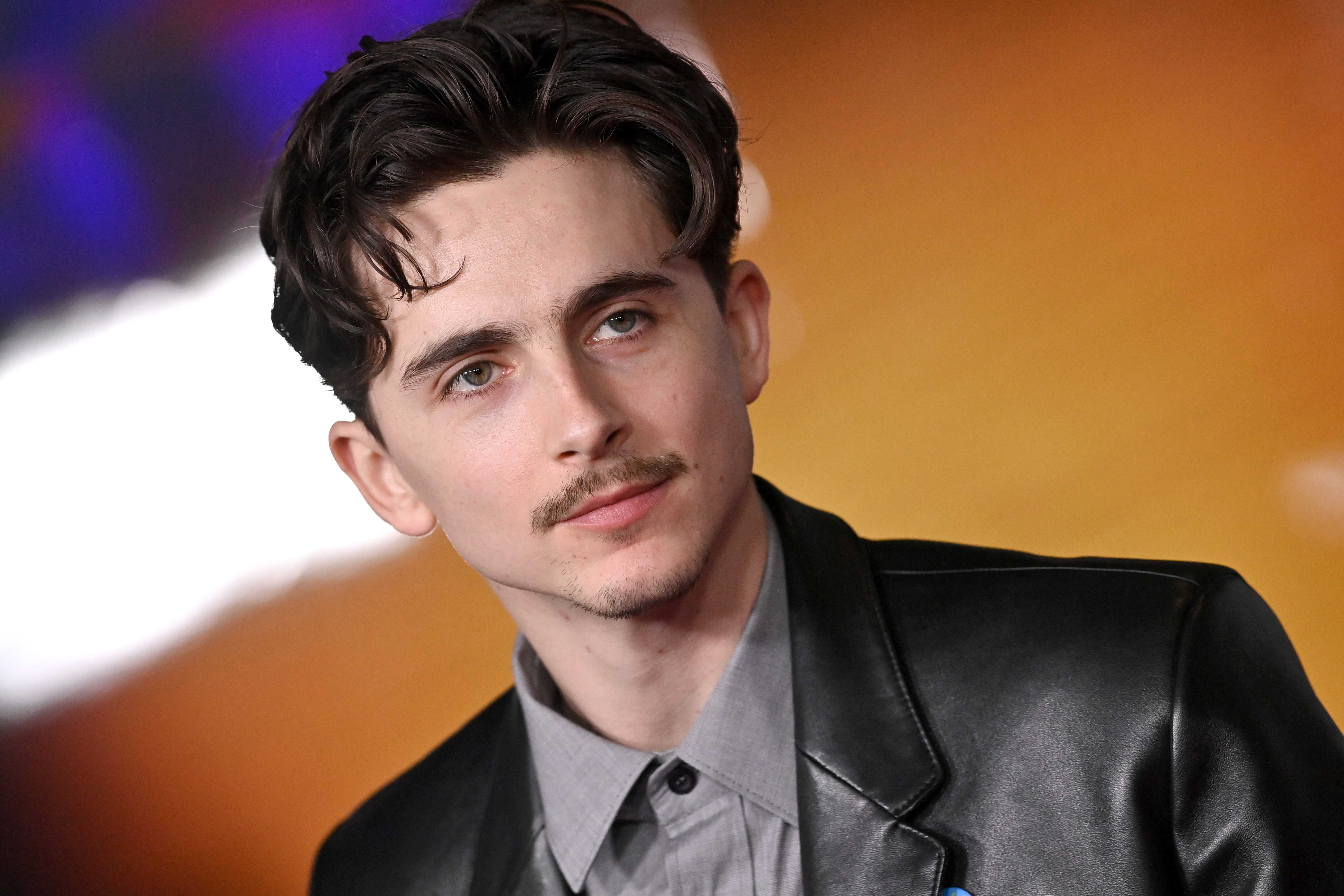 Timothée Chalamet attended the Los Angeles premiere of Searchlight Pictures' "A Complete Unknown" at the Dolby Theatre on December 10, 2024, in Hollywood, California, with his hair neatly styled and wearing a mustache for the event.