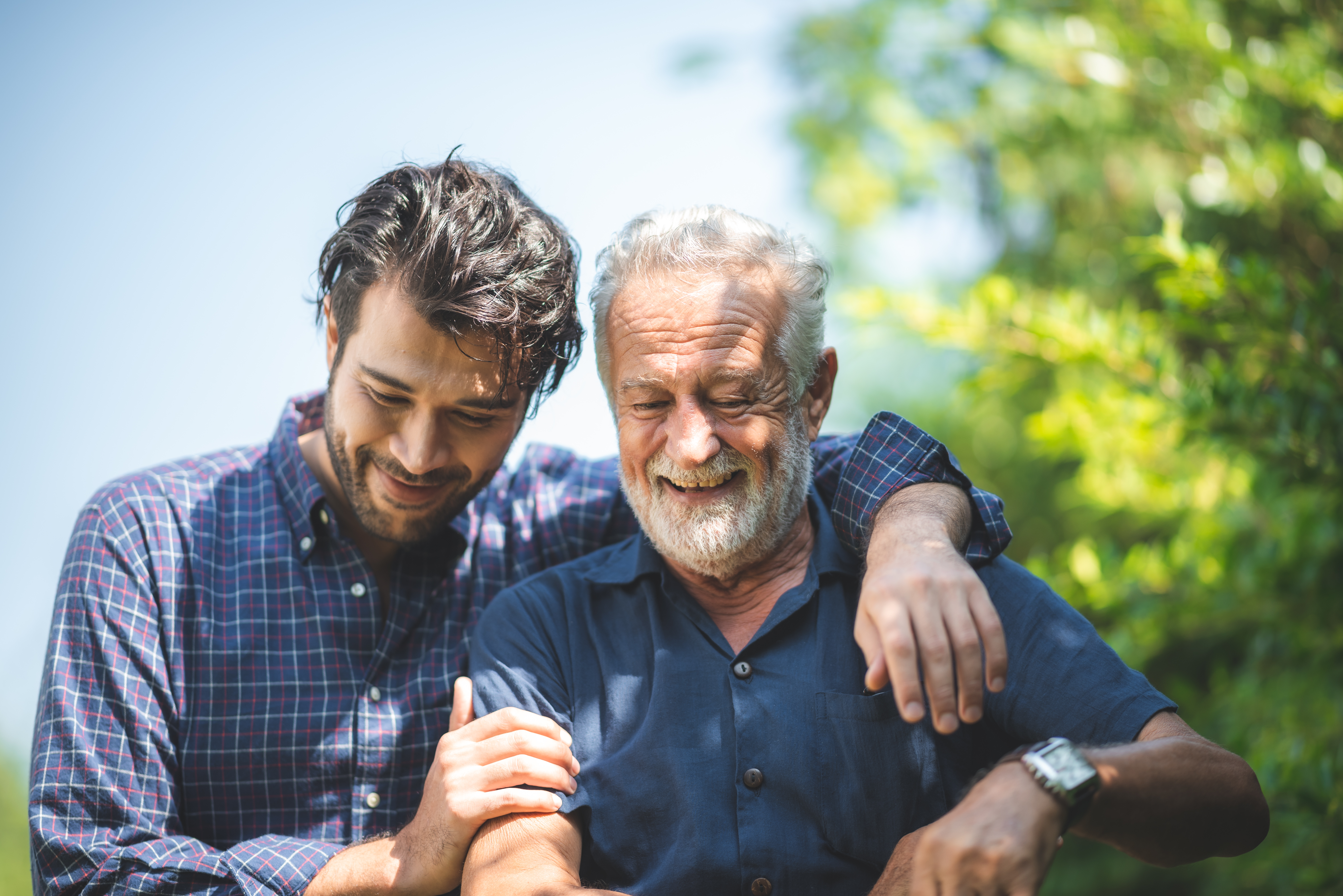 A young man with an older man | Source: Shutterstock