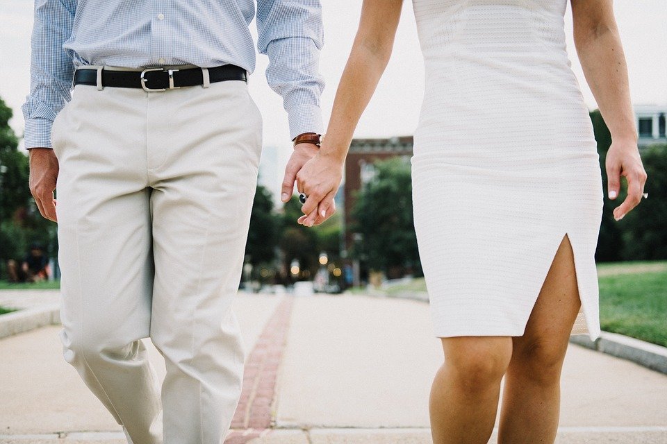 A man and his wife holding hands and walking down an isle together  | Photo: Pixabay